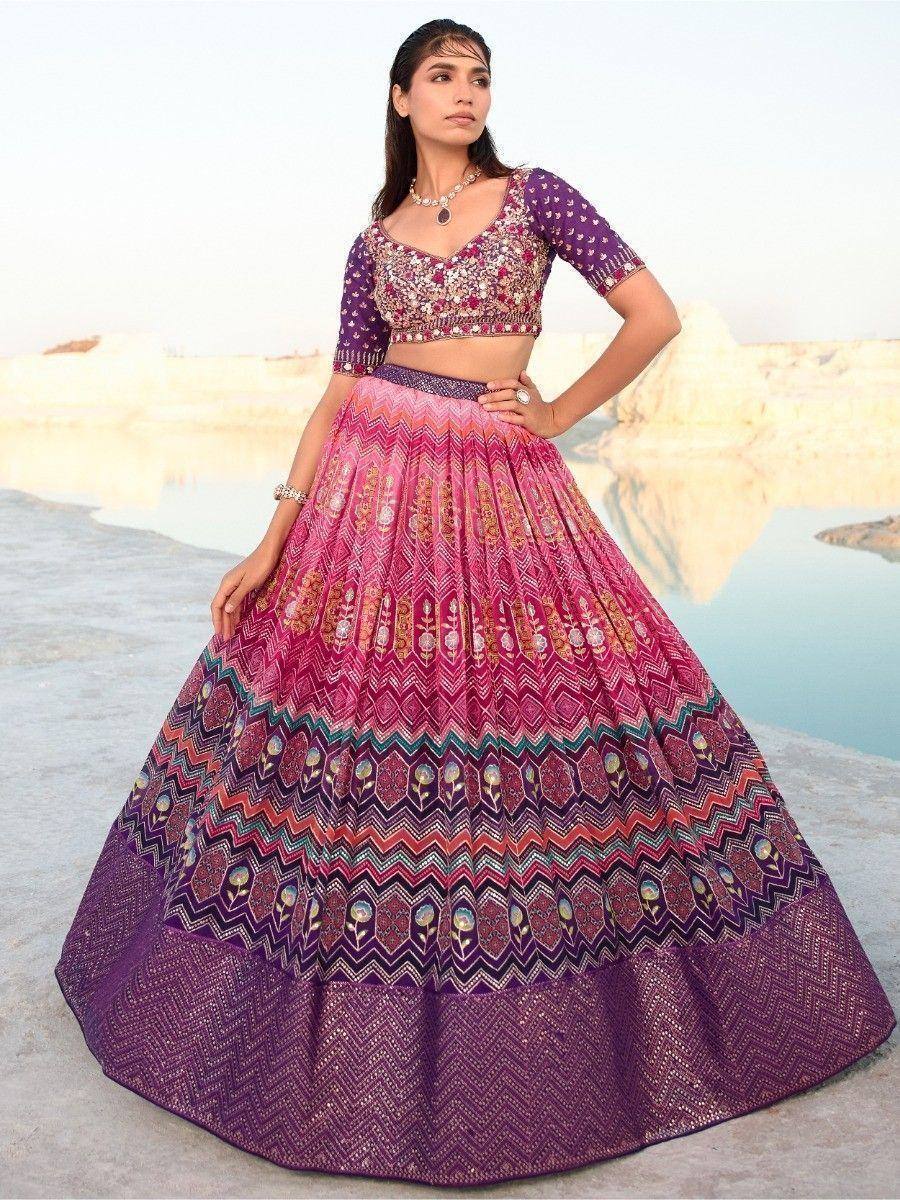 Purple and pink embroidered lehenga choli with geometric patterns, perfect for Indian ethnic occasions