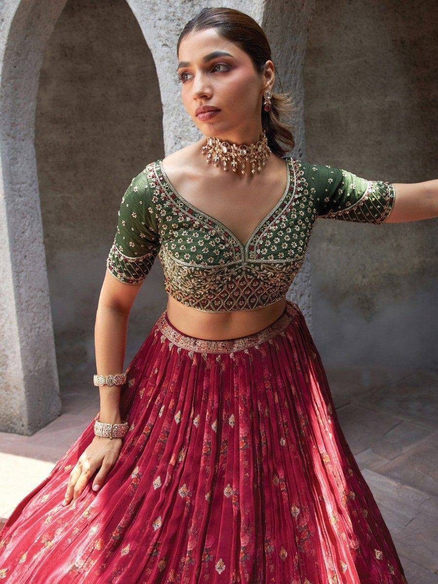 Green and maroon embroidered lehenga choli with floral motifs, perfect for Indian ethnic wear occasions.