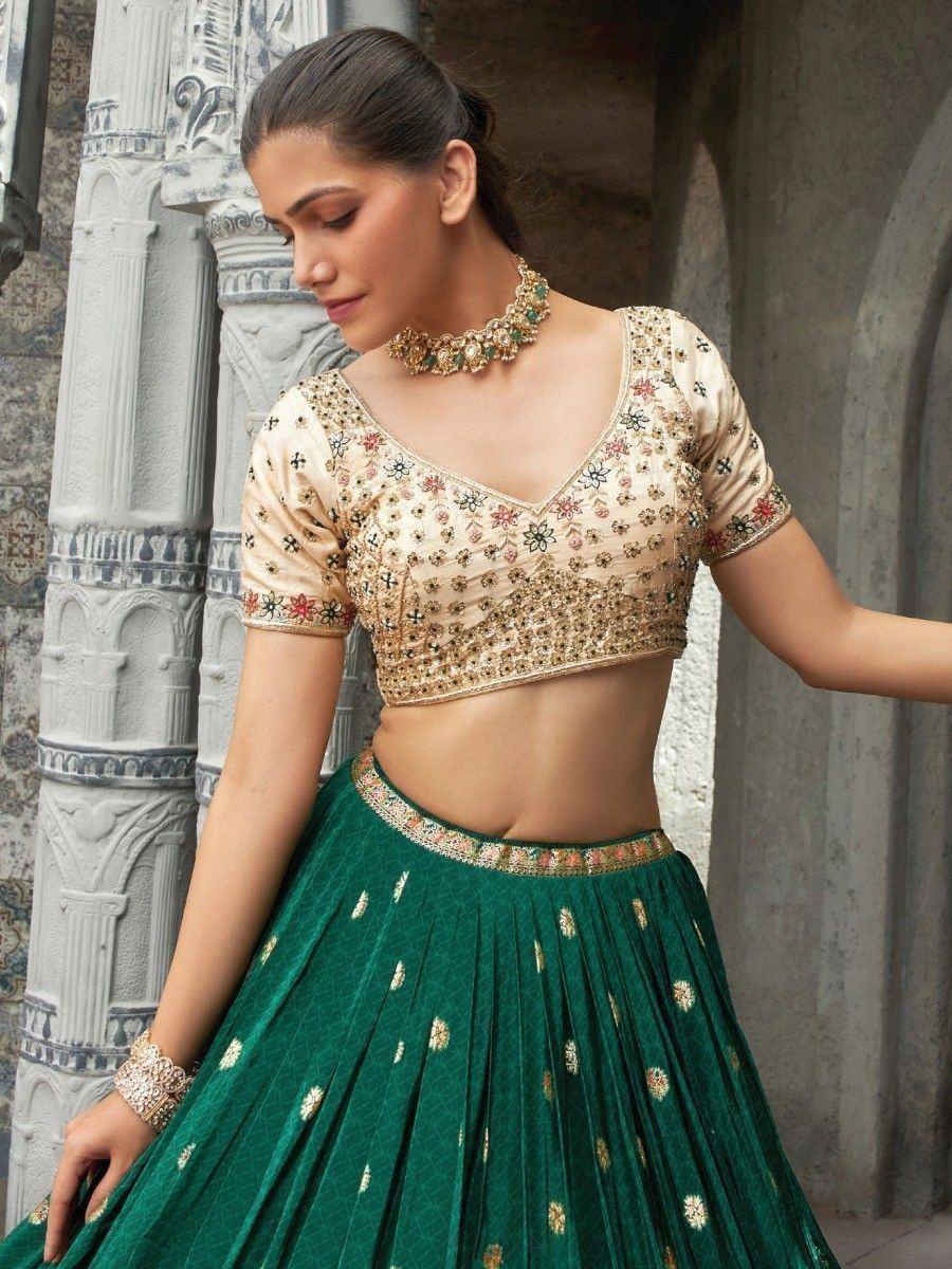 Elegant green lehenga choli with floral embroidery and gold detailing, perfect for Indian ethnic wear.