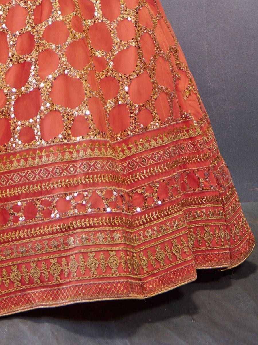 Orange lehenga skirt with gold sequin embroidery and intricate border detailing for Indian ethnic wear