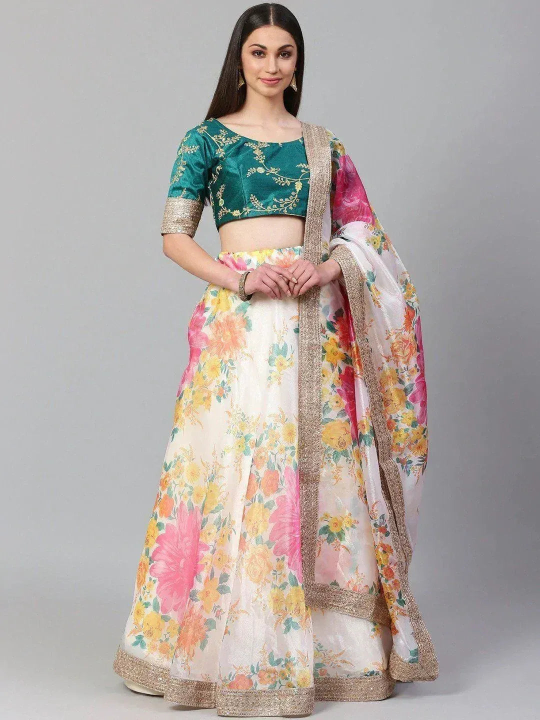 Floral print lehenga choli with green embroidered blouse and gold trim, perfect for Indian ethnic wear