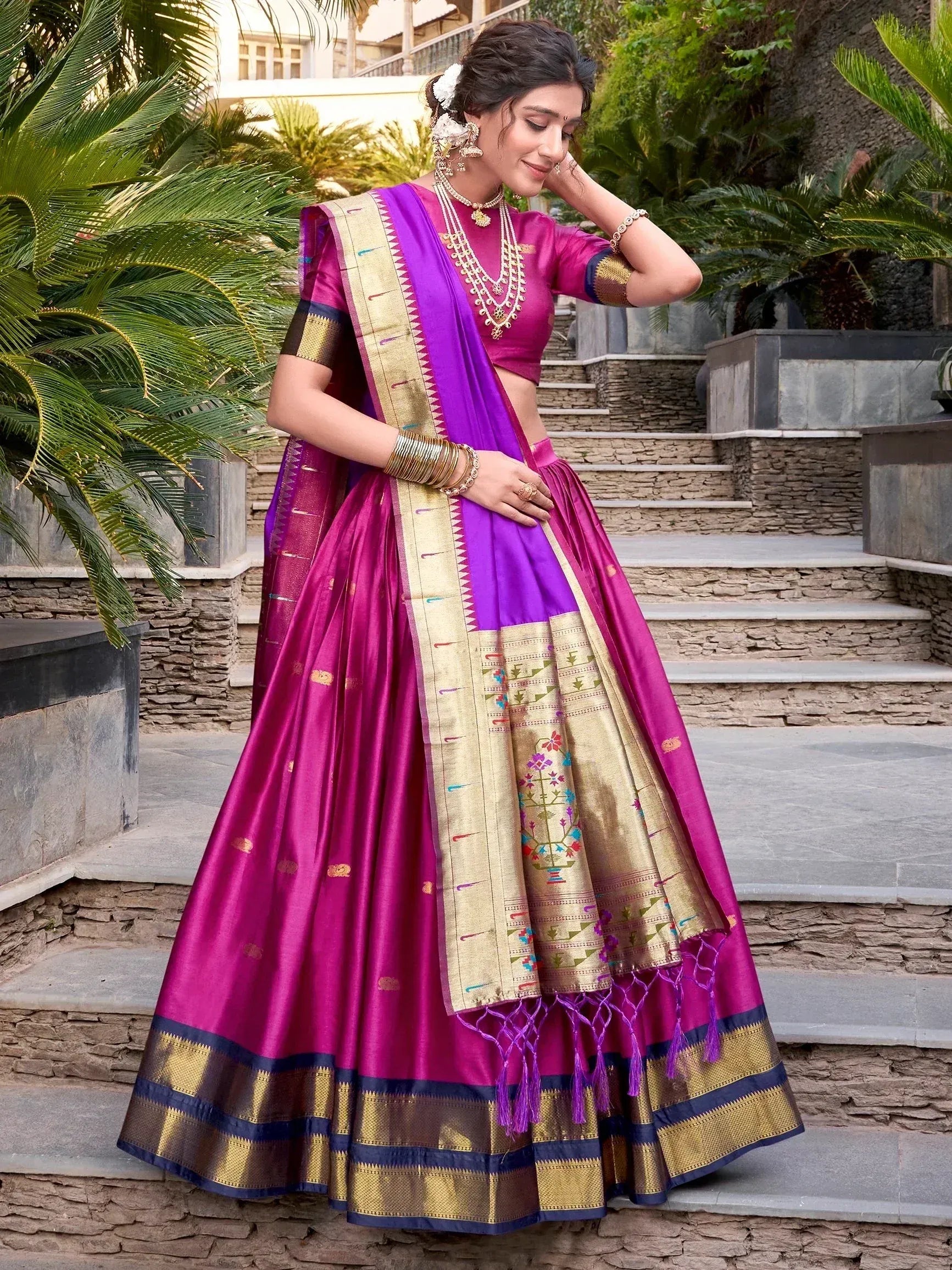 Purple and magenta designer lehenga choli with gold embroidery, perfect for Indian weddings and festive occasions