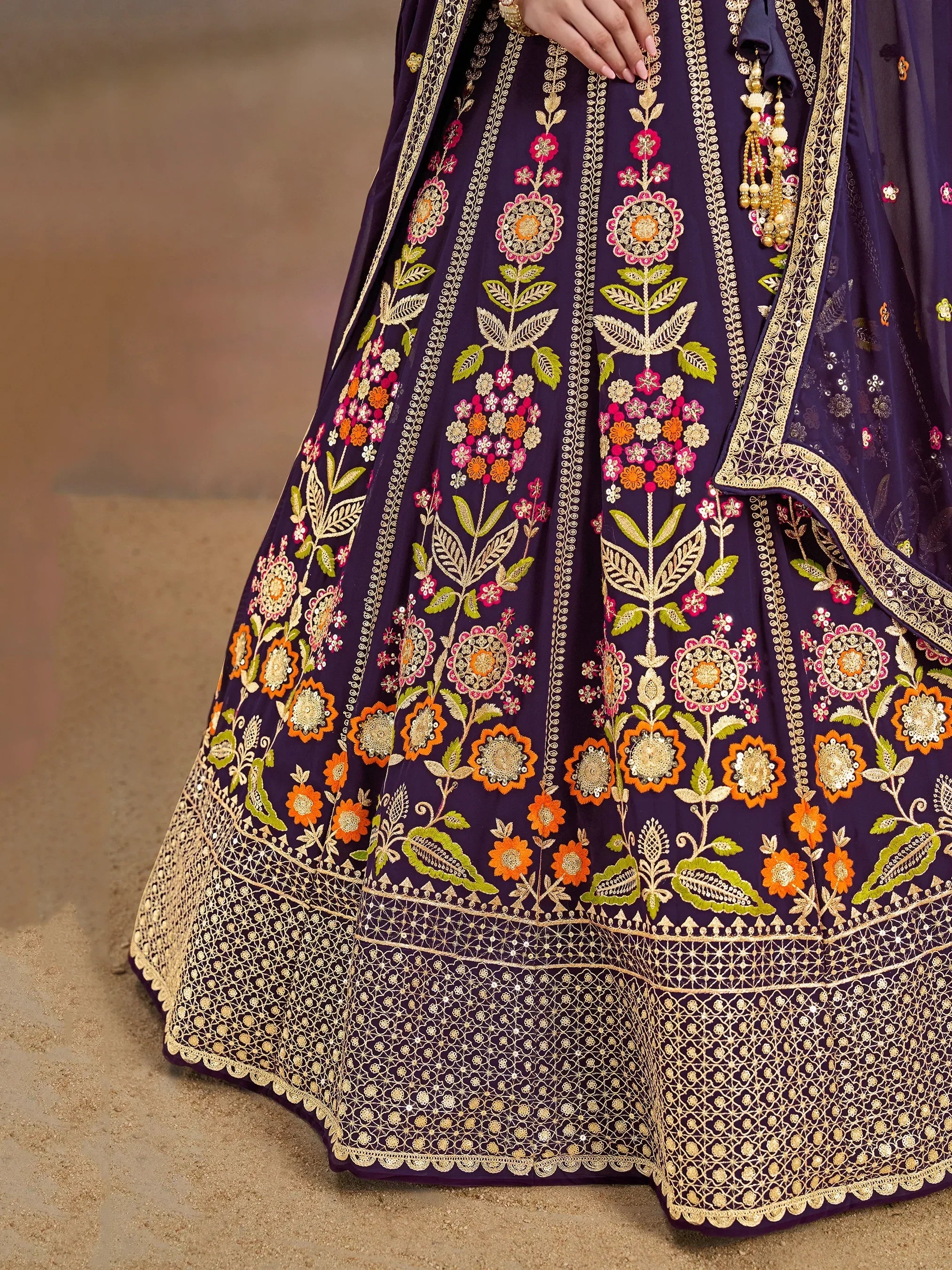 Purple lehenga choli with floral embroidery and gold detailing, perfect for Indian ethnic wear occasions