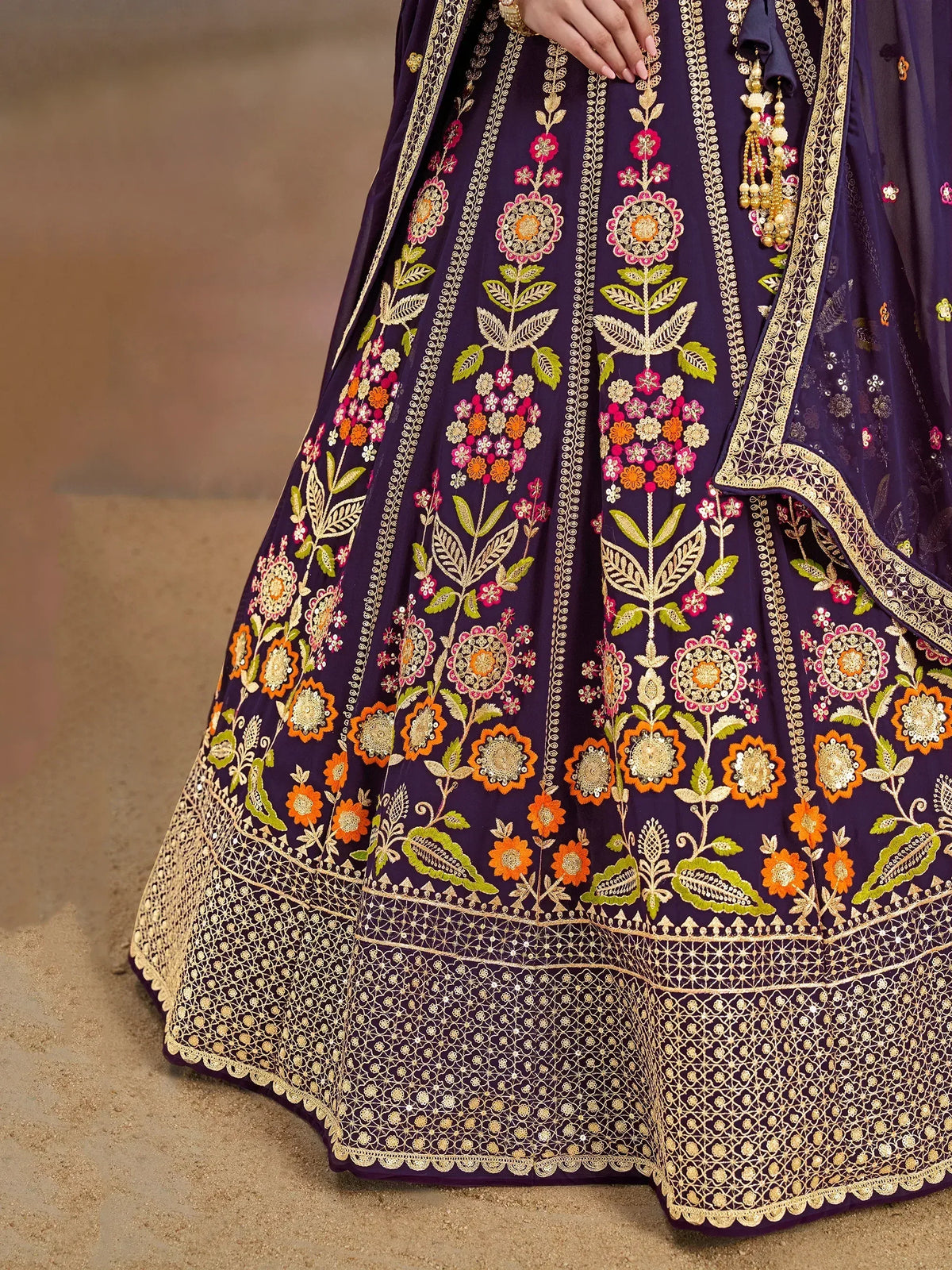 Purple lehenga choli with floral embroidery and gold detailing, perfect for Indian ethnic wear occasions
