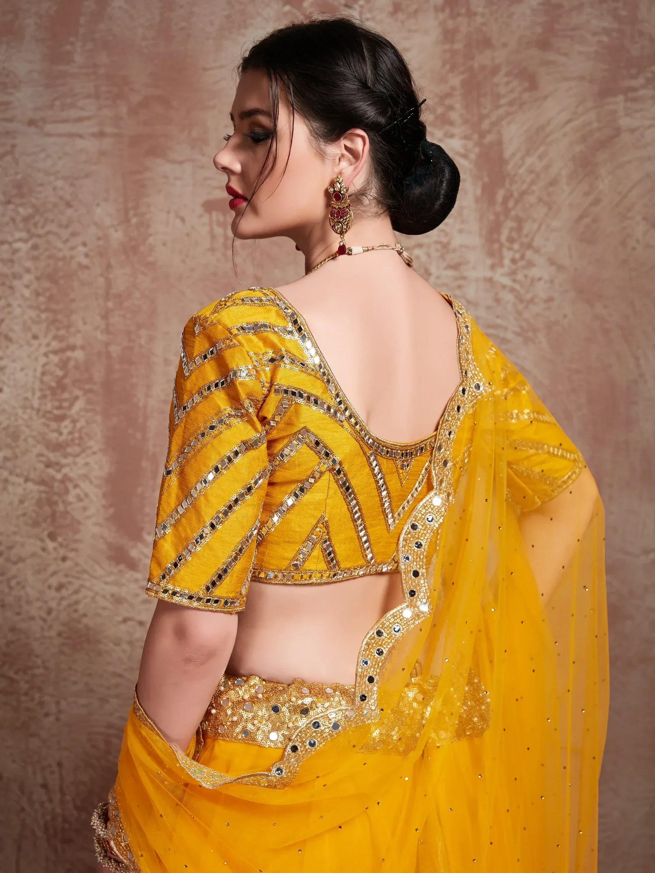 Yellow mirror-work lehenga choli with backless blouse, ethnic Indian wear