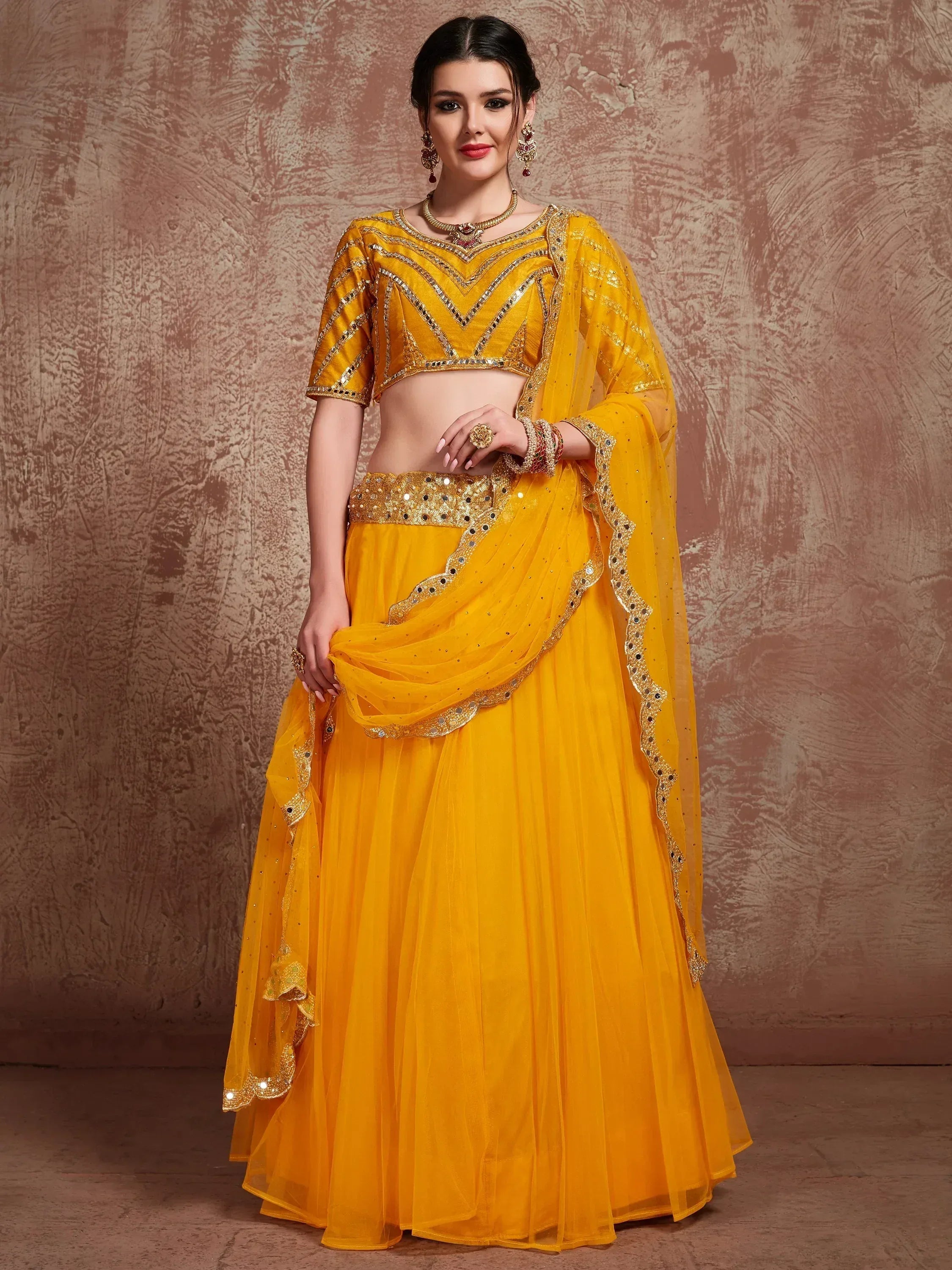 Yellow designer lehenga choli with mirror work and net dupatta, ethnic Indian wear for women