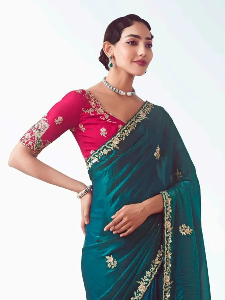 Emerald green velvet saree with gold embroidery and pink blouse, perfect for Indian ethnic occasions.