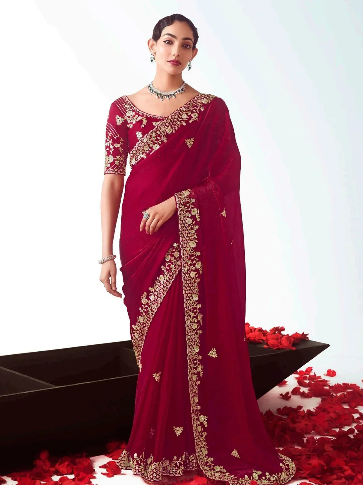 Elegant maroon saree with gold embroidery, perfect for Indian ethnic wear and festive occasions.