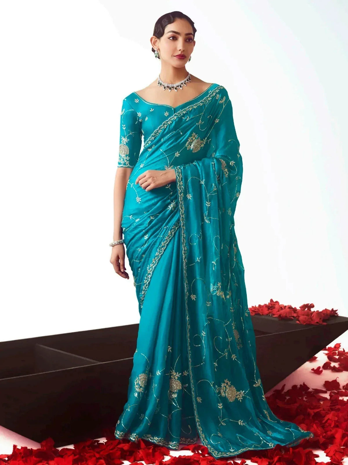 Teal designer saree with gold embroidery, perfect for Indian ethnic wear and festive occasions
