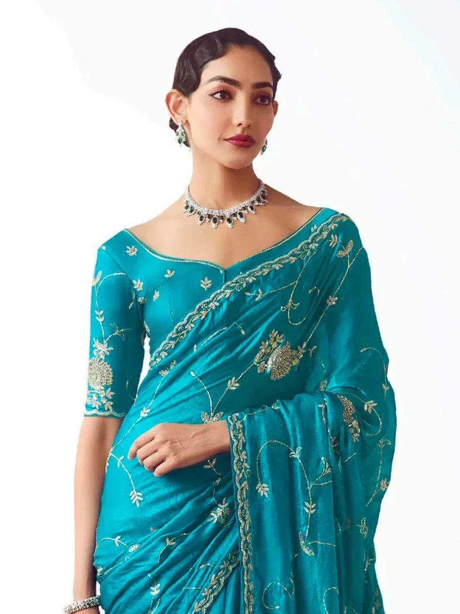 Teal embroidered saree with gold floral work, perfect for Indian ethnic occasions