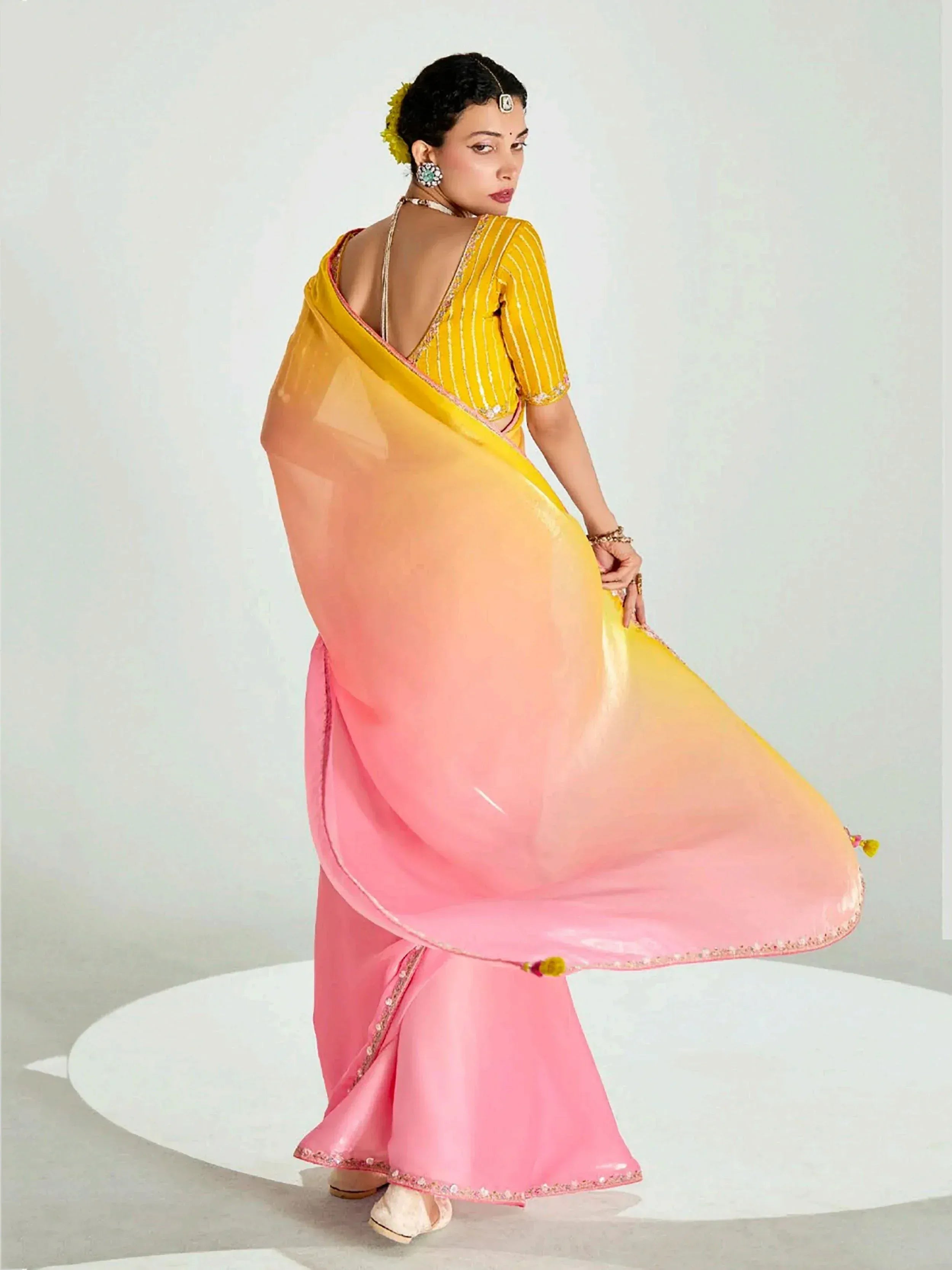 Elegant pink and yellow gradient saree with designer blouse, perfect for Indian ethnic wear