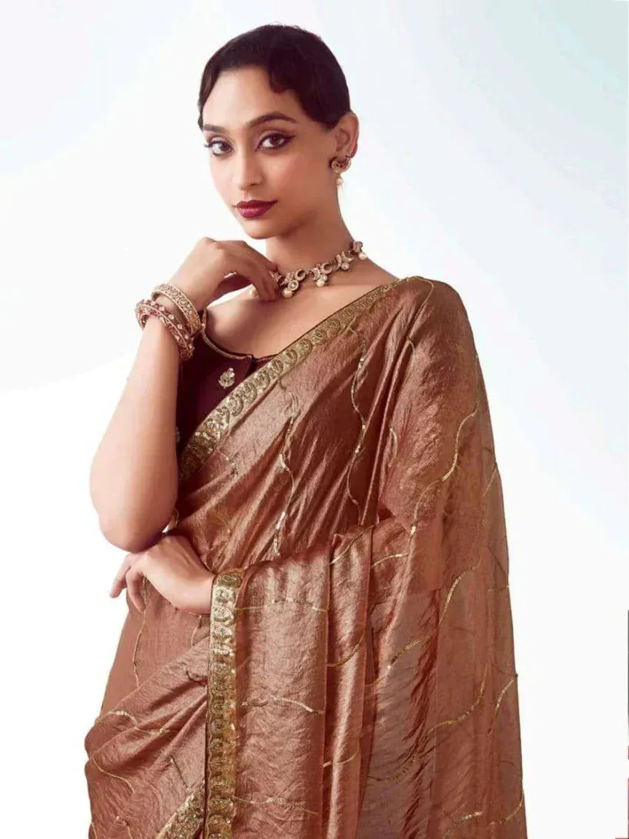 Elegant brown saree with gold embroidery, perfect for Indian ethnic wear occasions
