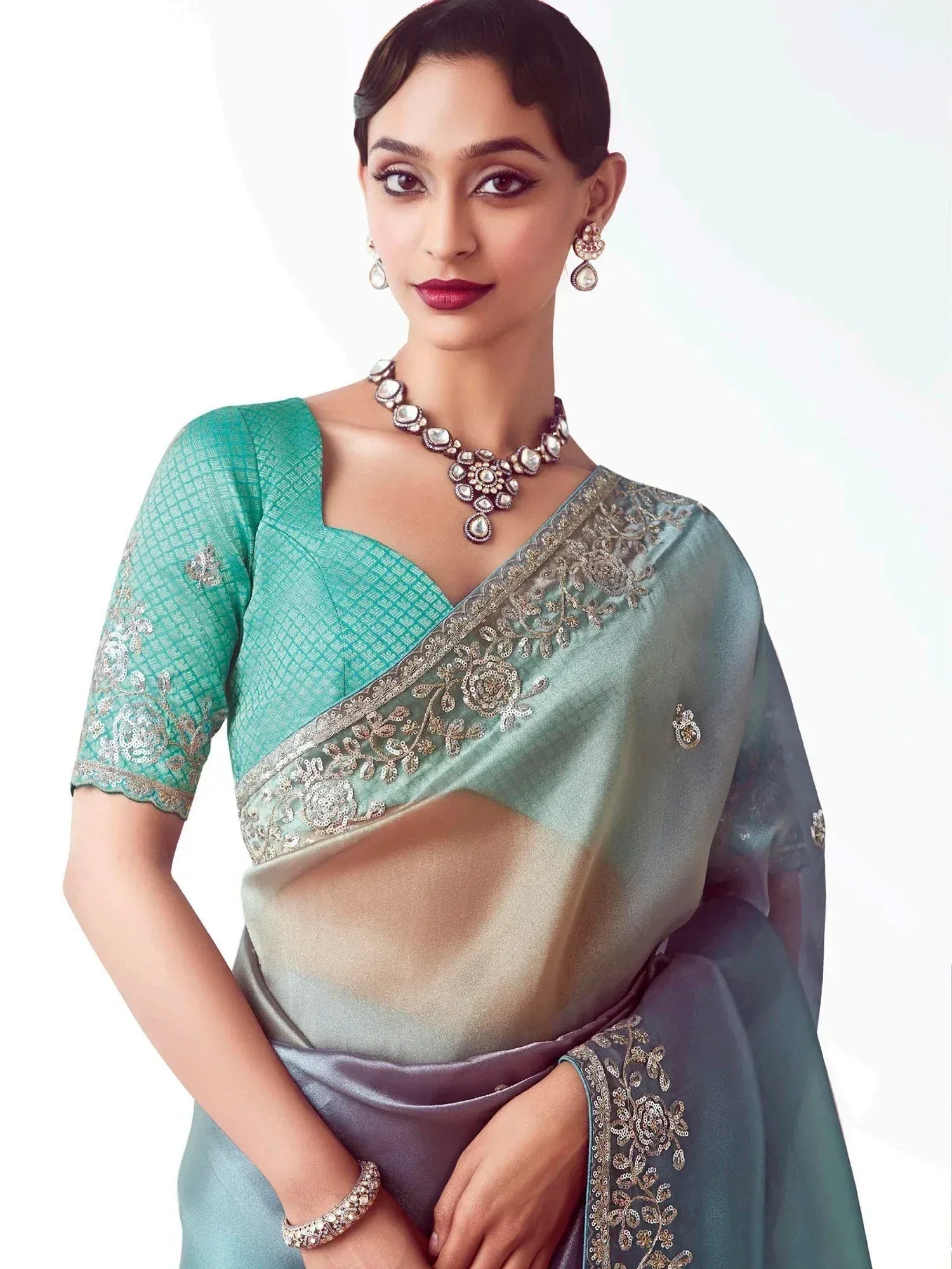 Elegant teal and grey saree with gold embroidery, perfect for Indian ethnic wear and festive occasions.