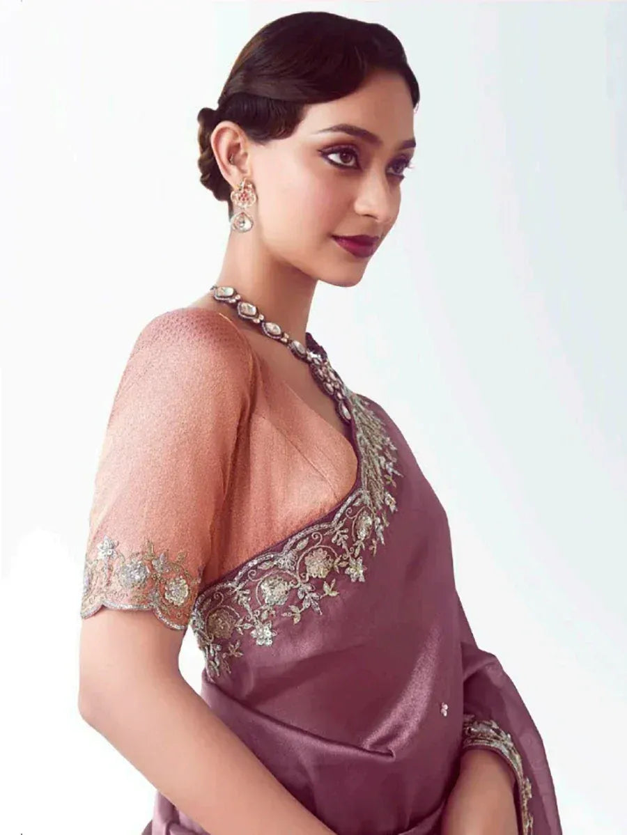 Elegant mauve saree with gold embroidery and sheer blouse, perfect for Indian ethnic occasions