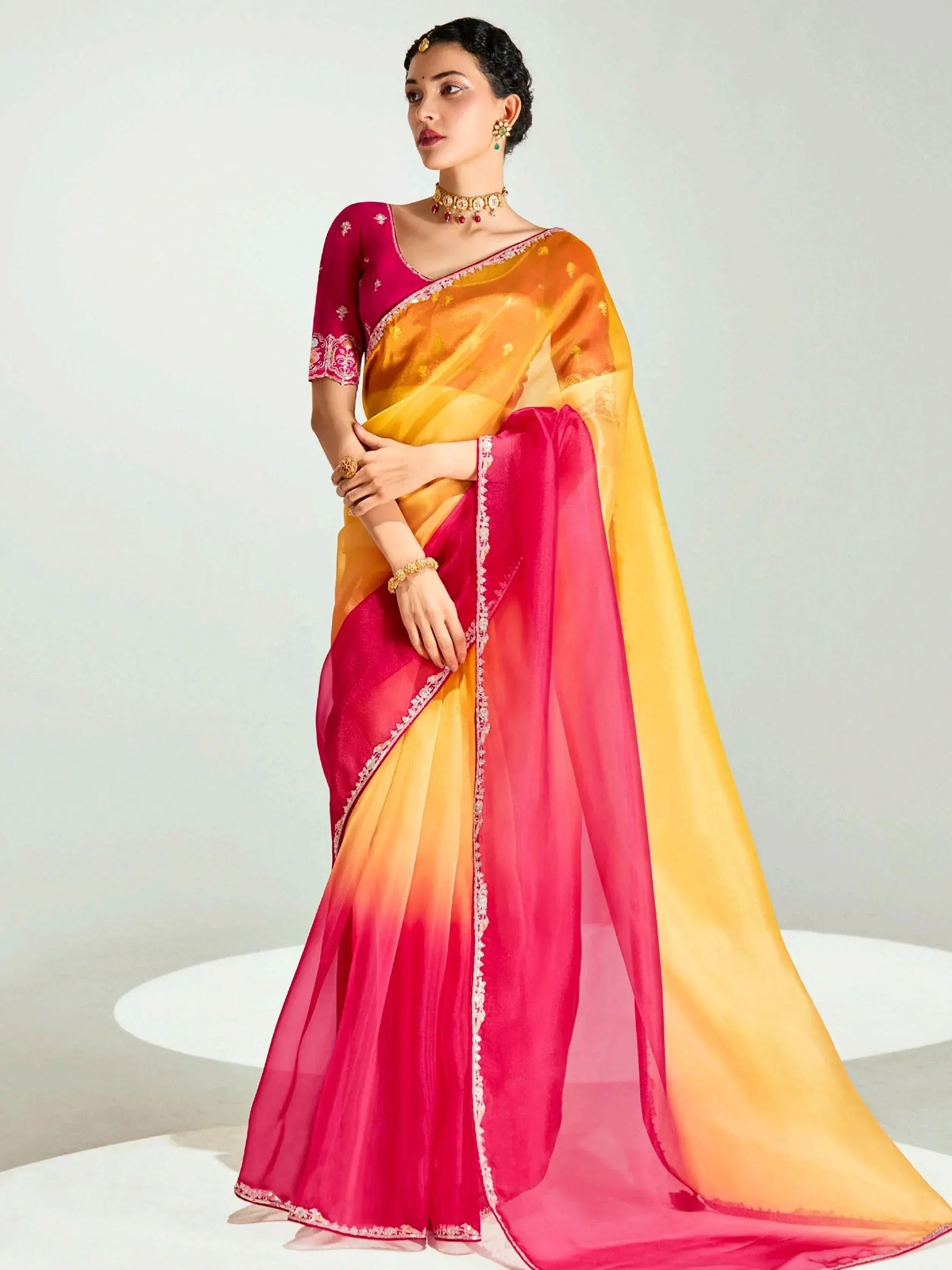 Vibrant pink and yellow ombre saree with embroidered blouse, perfect for Indian ethnic occasions