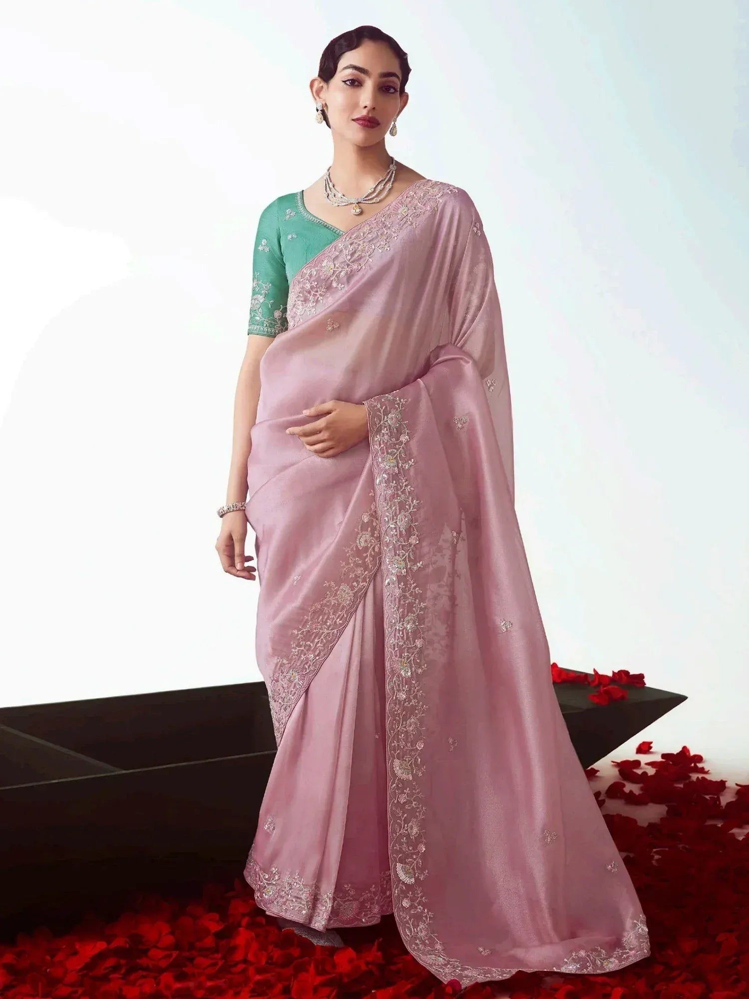 Pink embroidered saree with green blouse, Indian ethnic wear for women, floral detailing, rose petals