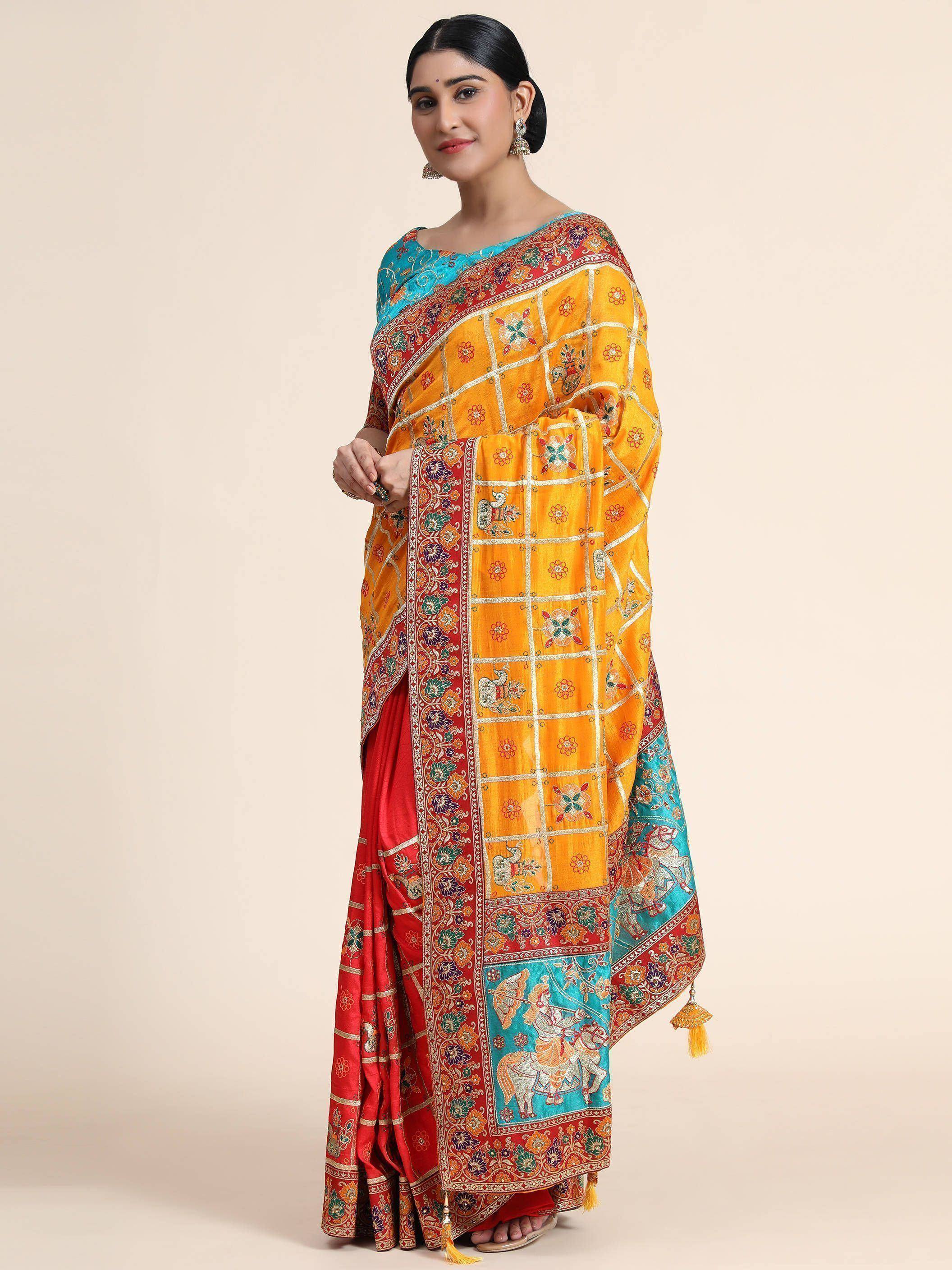 Vibrant yellow and red embroidered saree with peacock motifs, paired with turquoise blouse, ideal for Indian ethnic occasions.