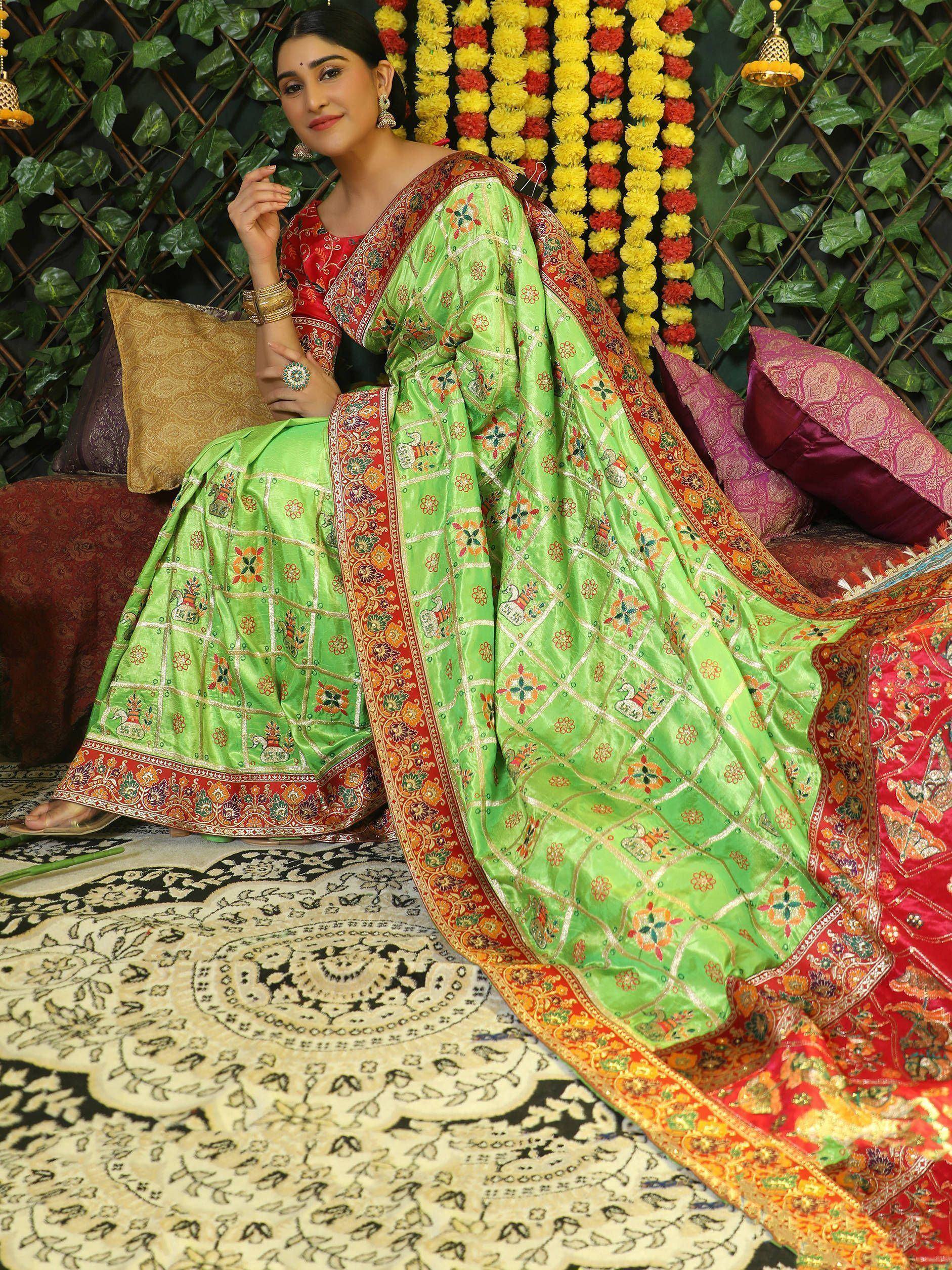 Green embroidered lehenga choli with red blouse, perfect for Indian ethnic wear and festive occasions.