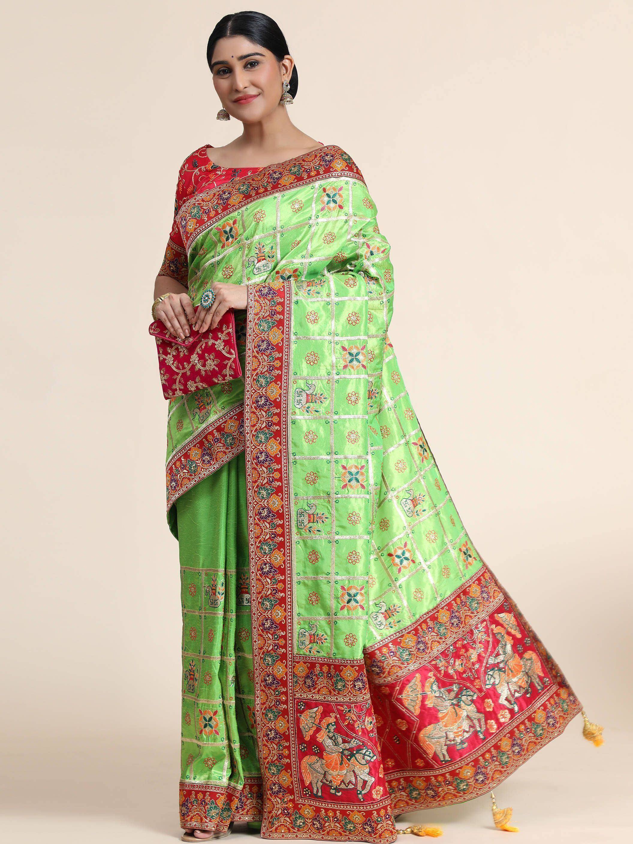 Green and red embroidered saree with floral and elephant motifs, perfect for Indian ethnic occasions