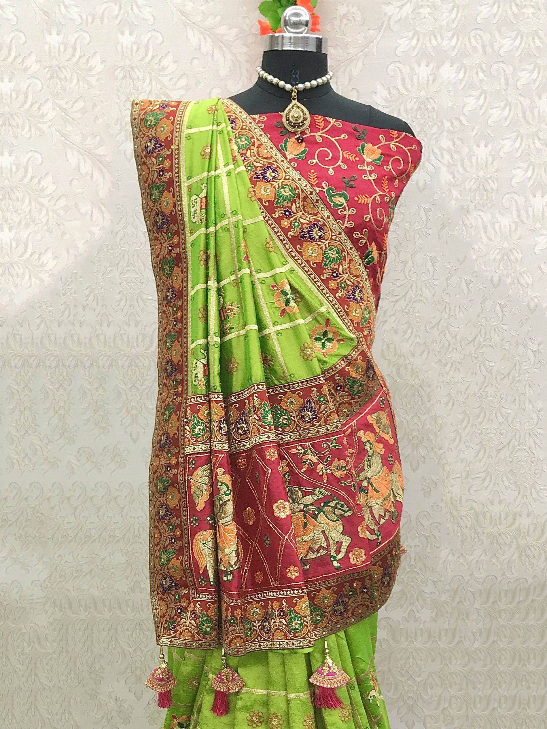 Green and maroon embroidered saree with floral and elephant motifs, perfect for Indian ethnic wear occasions.