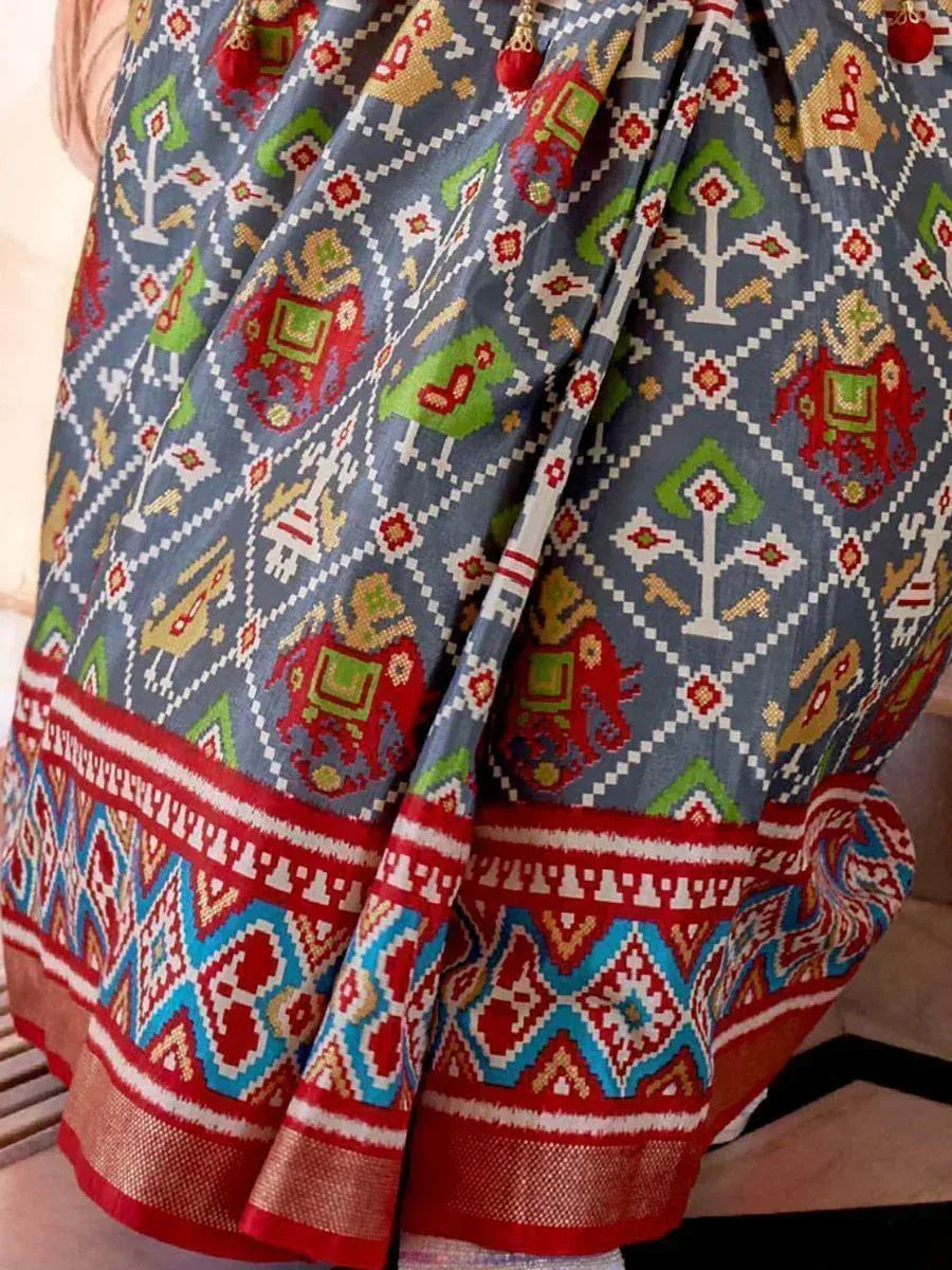 Colorful ethnic printed lehenga skirt with elephant motifs and geometric border, ideal for Indian festive wear.