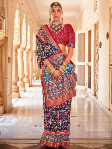 Capricious Navy Blue Patola Printed Silk Festive Wear Saree with Blouse