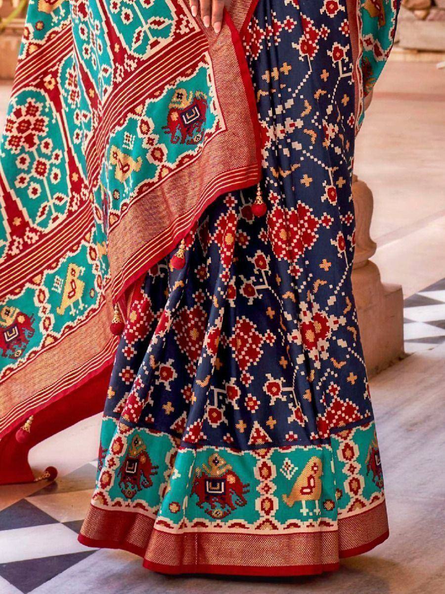 Blue and turquoise printed saree with elephant motifs and red border, ethnic Indian wear