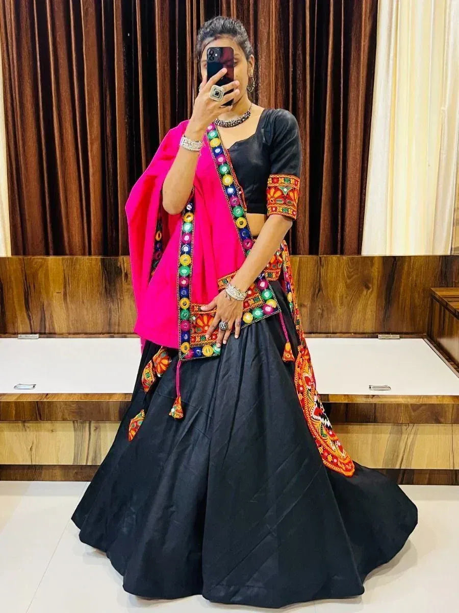 Black embroidered lehenga choli with vibrant pink dupatta, perfect for Indian ethnic occasions