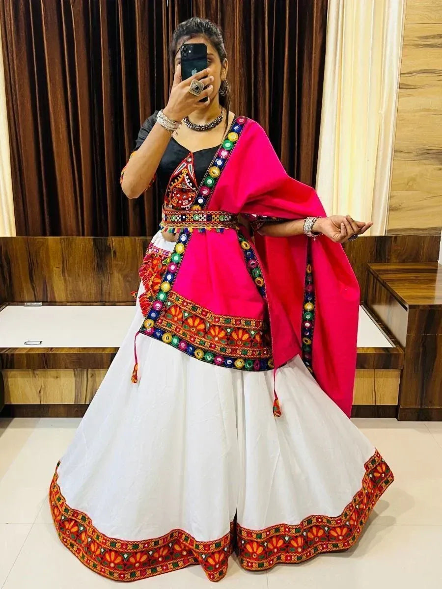 Vibrant pink and white embroidered lehenga choli with mirror work, perfect for Indian ethnic occasions