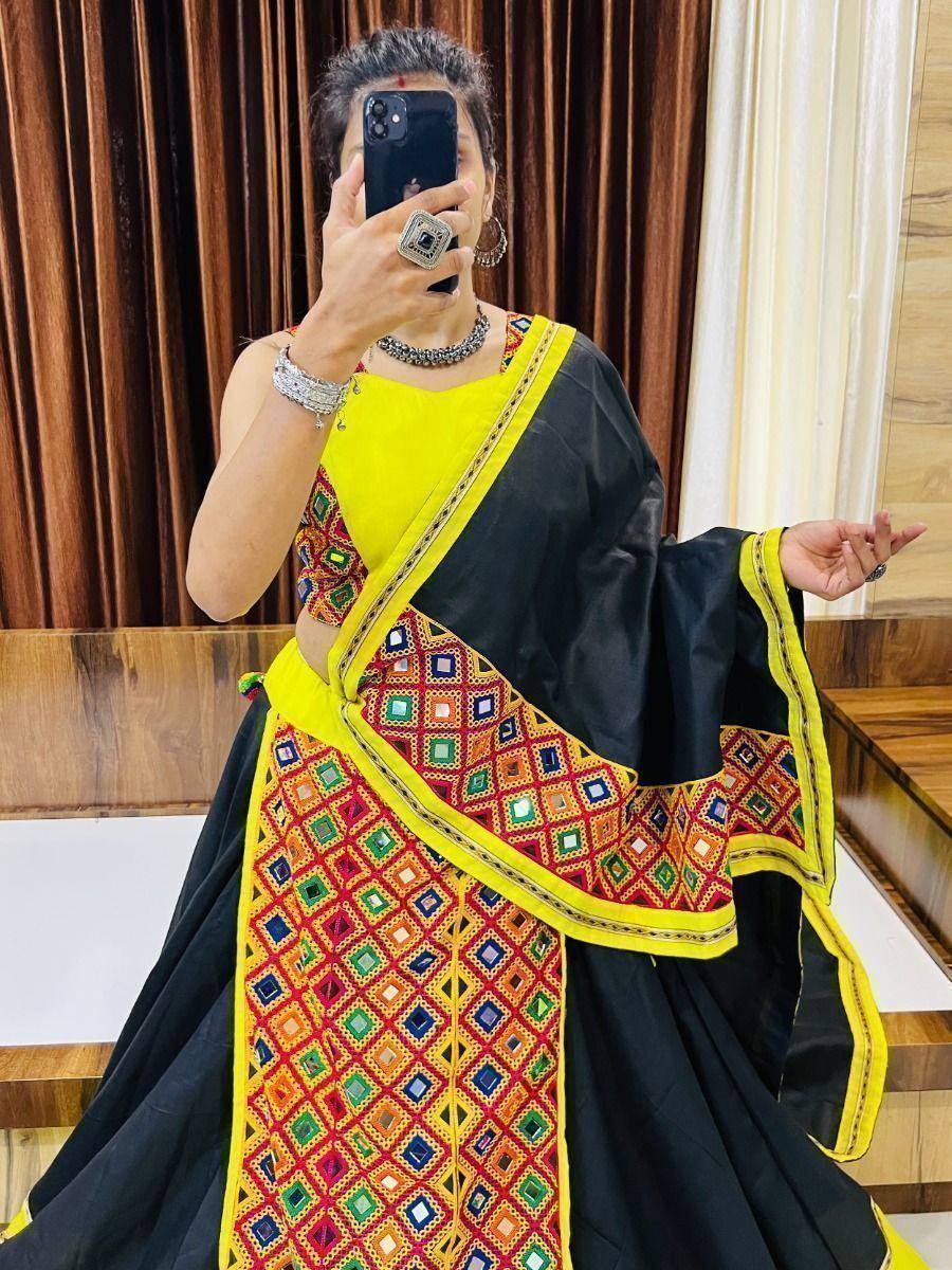 Black and yellow ethnic saree with colorful mirror work, perfect for Indian festive occasions
