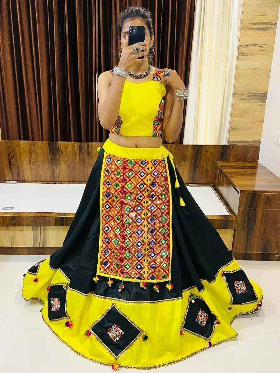 Vibrant yellow and black mirror work lehenga choli with ethnic embroidery, perfect for festive occasions
