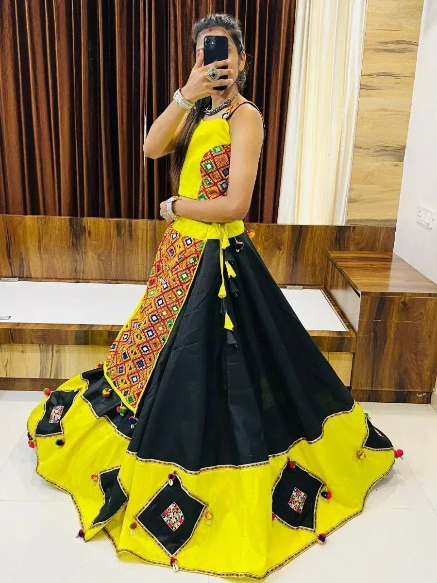 Yellow and black embroidered lehenga choli with mirror work, perfect for Indian ethnic wear occasions