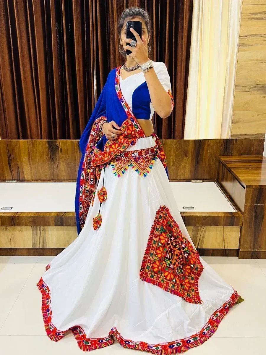 White and blue embroidered lehenga choli with colorful mirror work, perfect for Indian ethnic wear