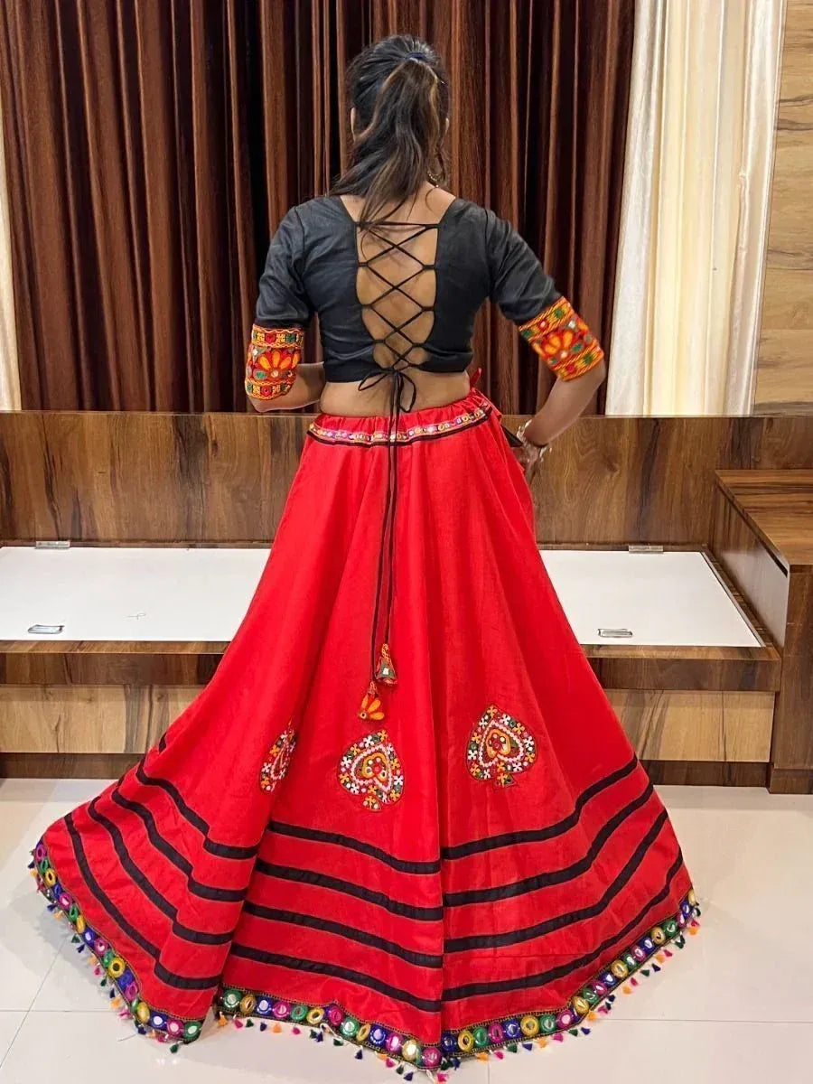 Red embroidered lehenga with black crisscross back blouse, ethnic Indian wear