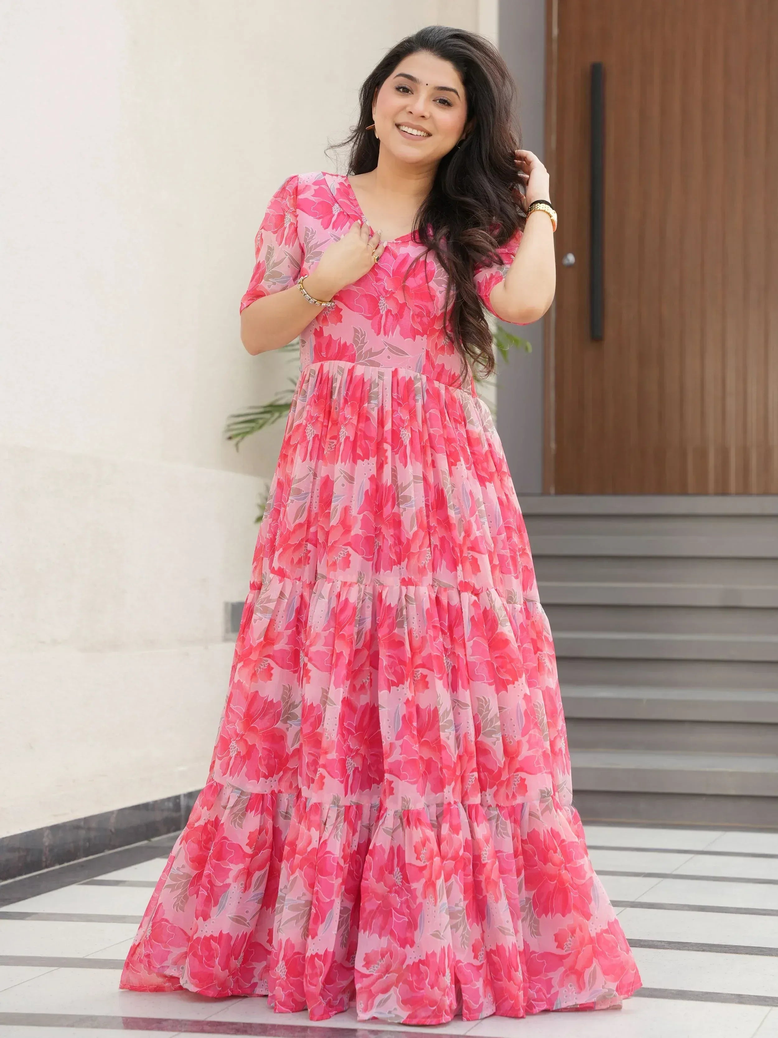 Pink floral ethnic gown with tiered skirt, perfect for festive occasions and Indian wear