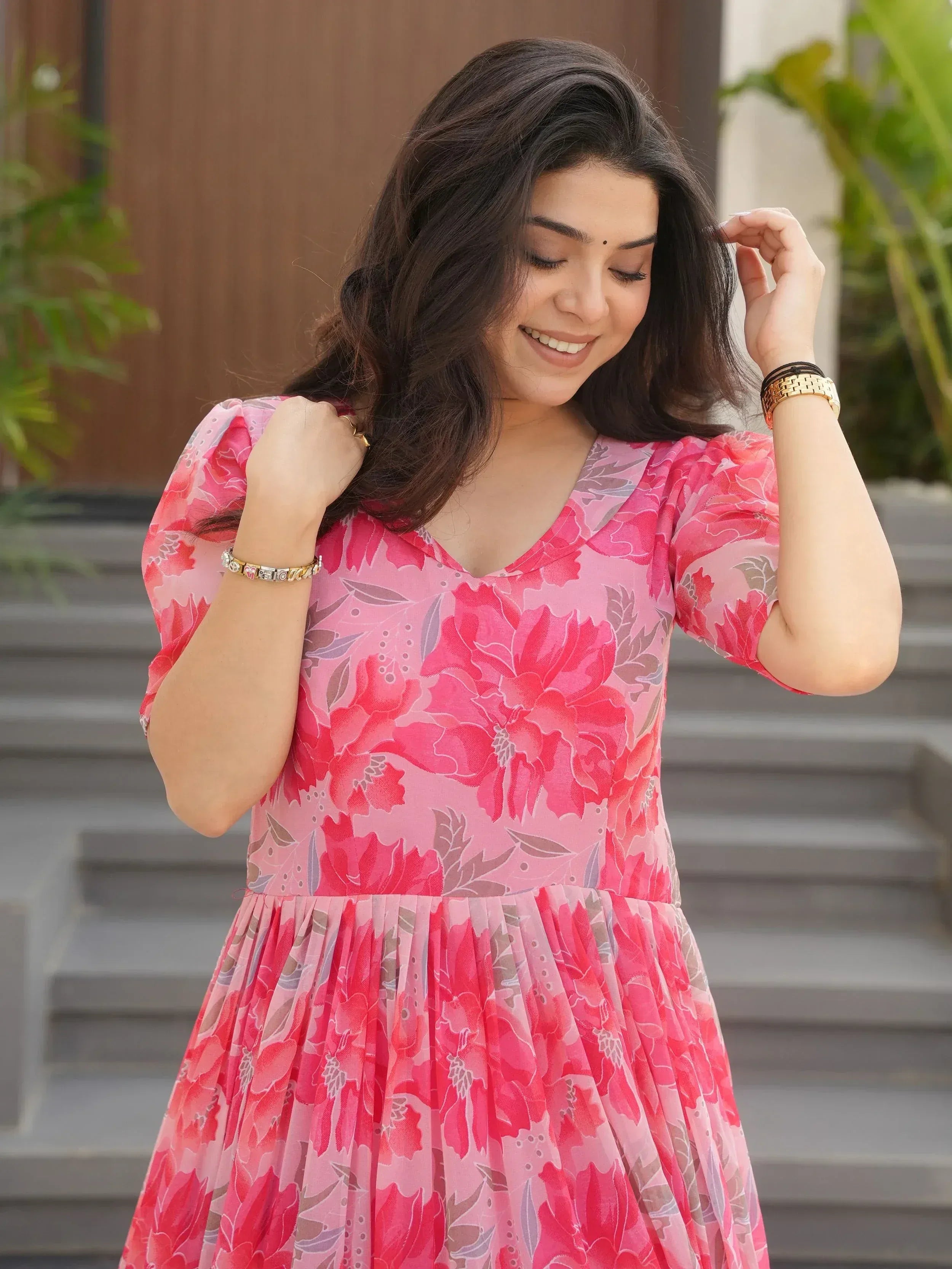 Pink floral ethnic gown with puff sleeves, perfect for Indian occasions and festive wear.
