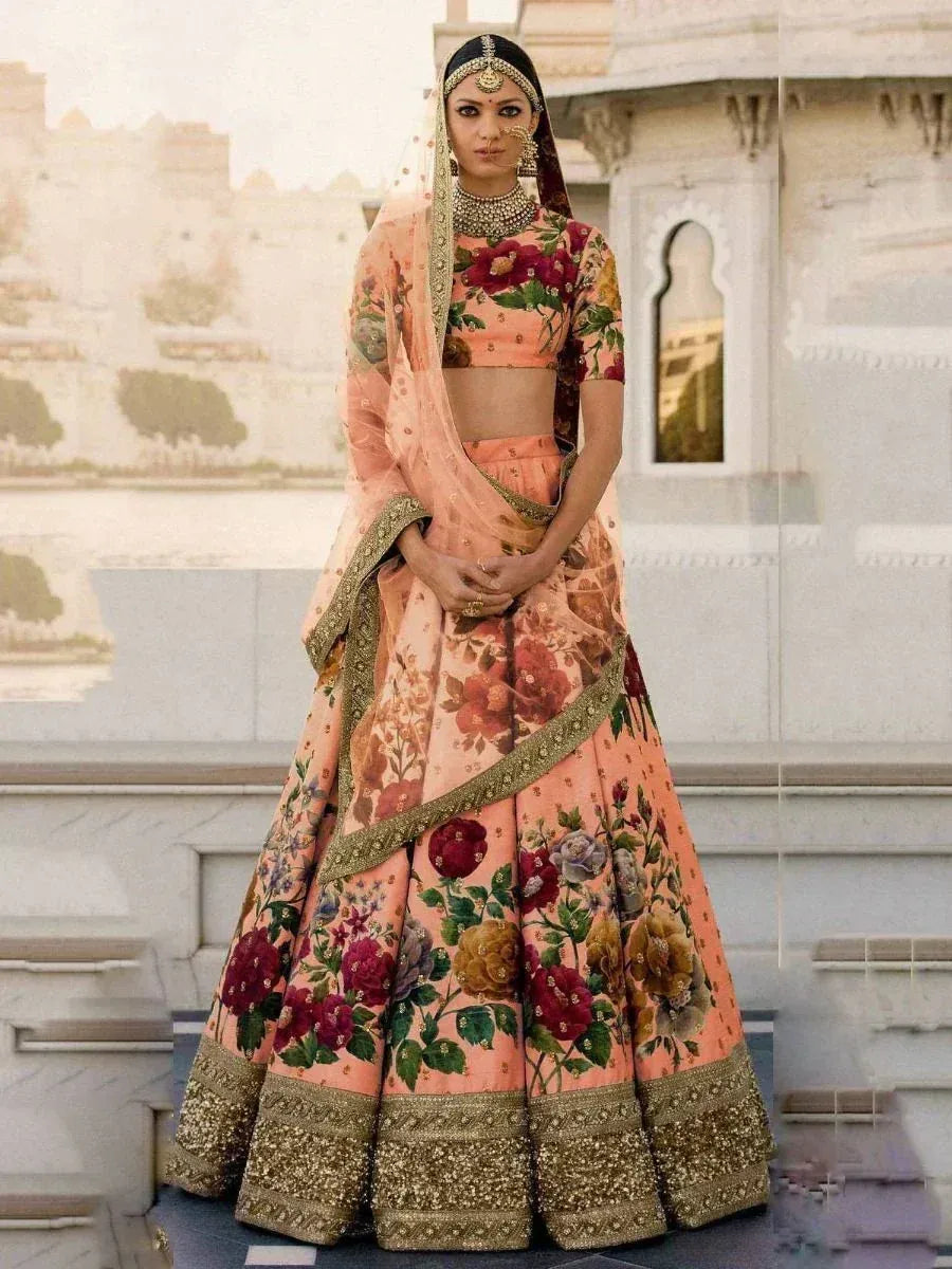 Floral print peach lehenga choli with gold embroidery, perfect for Indian weddings and ethnic events