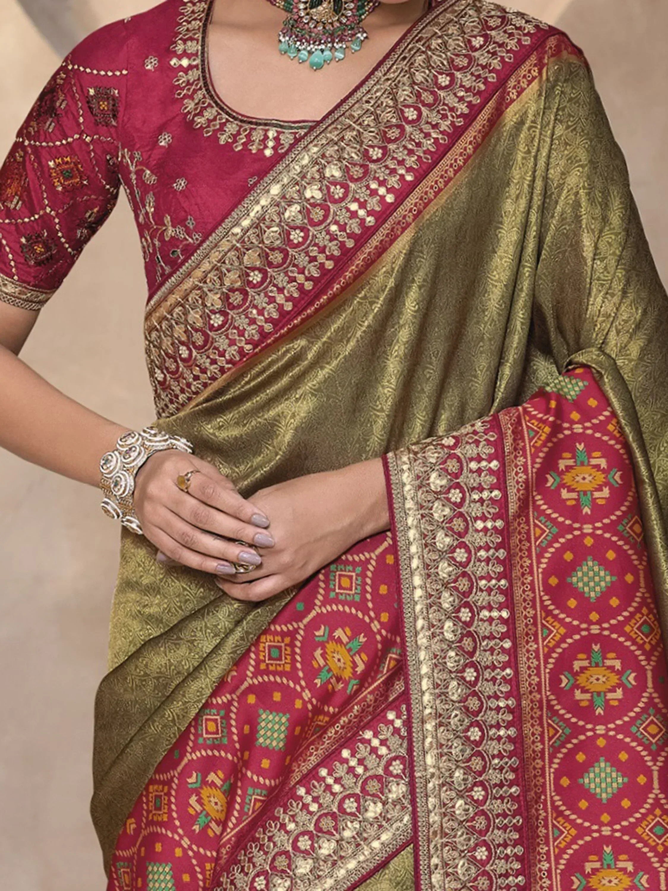 Elegant Indian saree with gold and maroon embroidery, perfect for festive occasions and weddings.