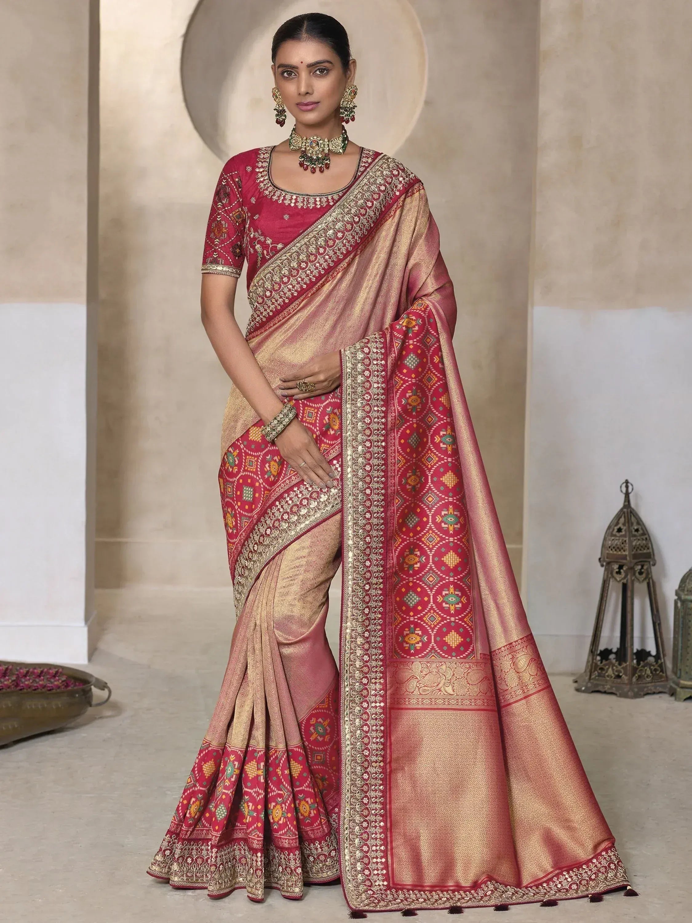 Elegant maroon and gold designer saree with intricate embroidery, perfect for Indian ethnic occasions.