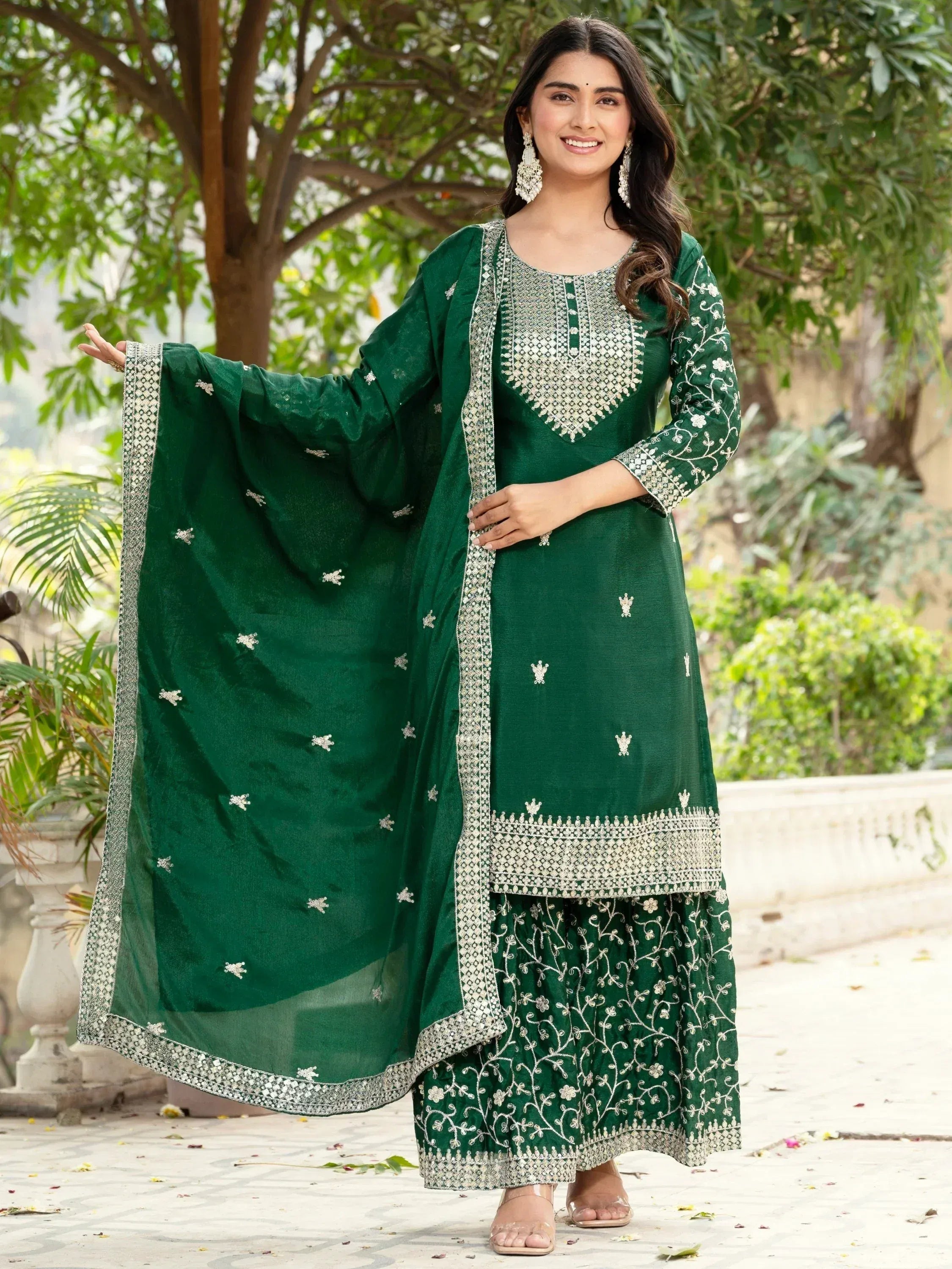 Emerald green embroidered salwar kameez with floral work and dupatta, perfect for Indian ethnic occasions.