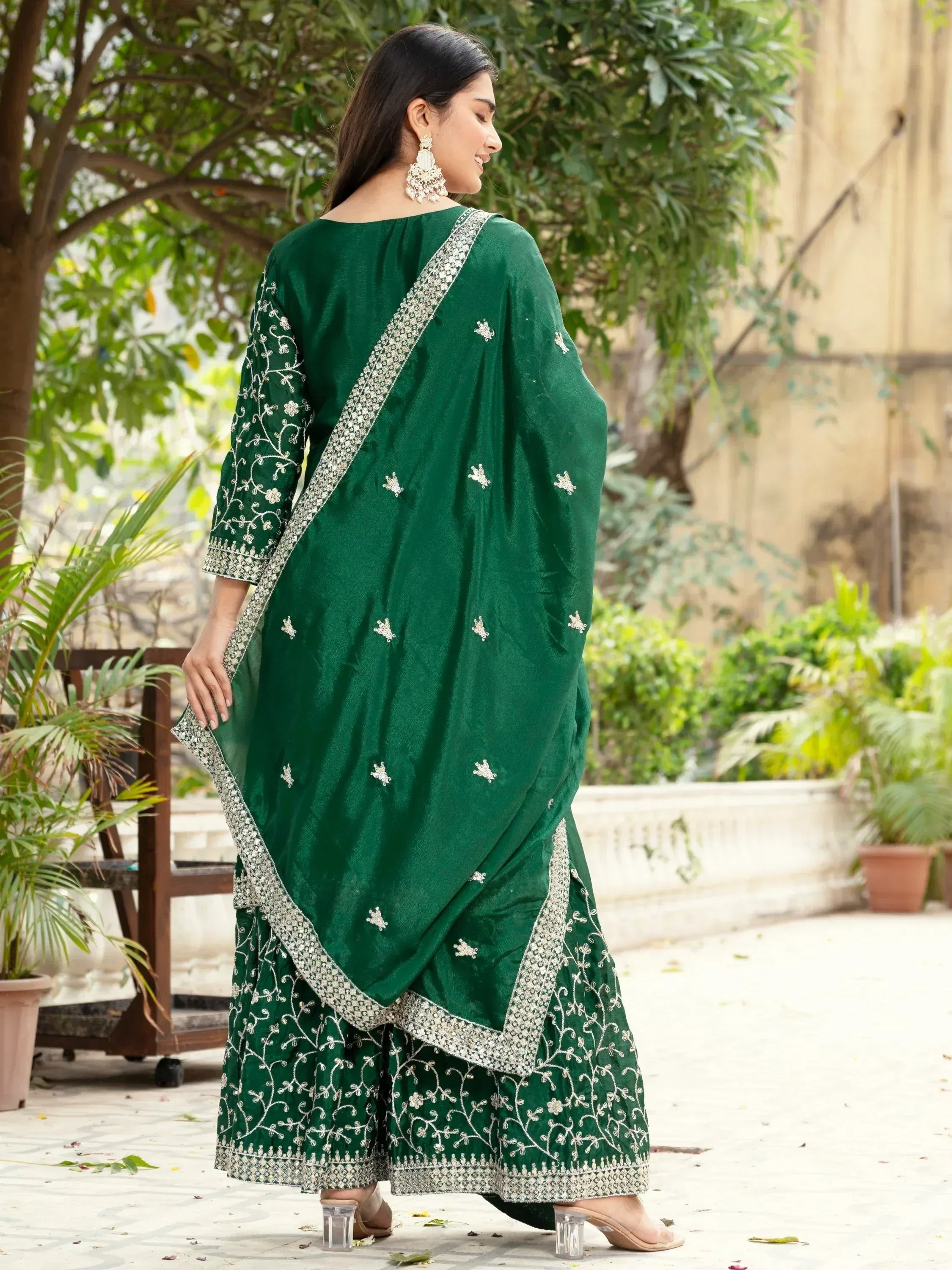 Emerald green embroidered salwar kameez with silver detailing, perfect for Indian ethnic wear occasions.
