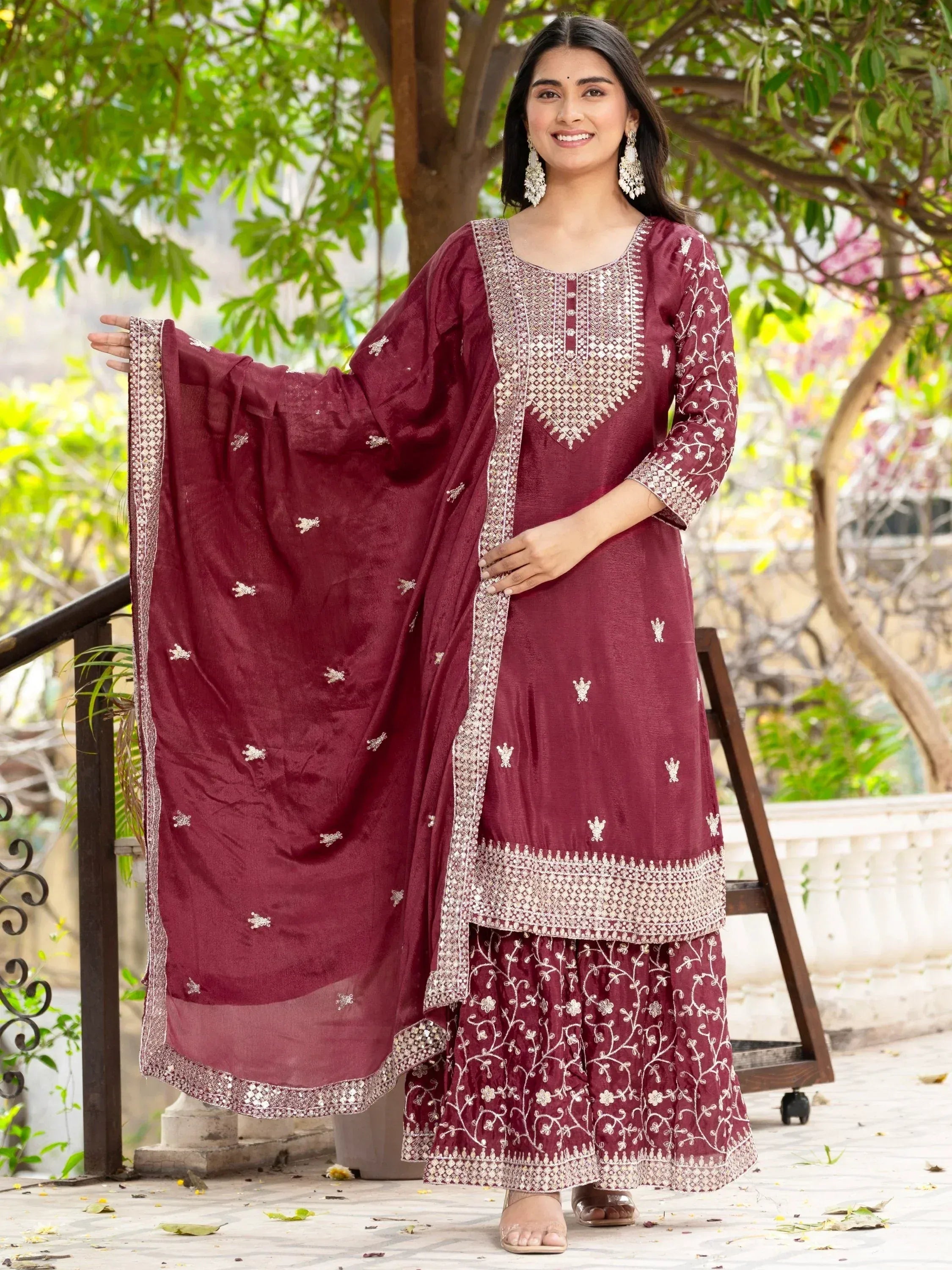 Maroon embroidered salwar kameez with floral patterns and matching dupatta for ethnic wear