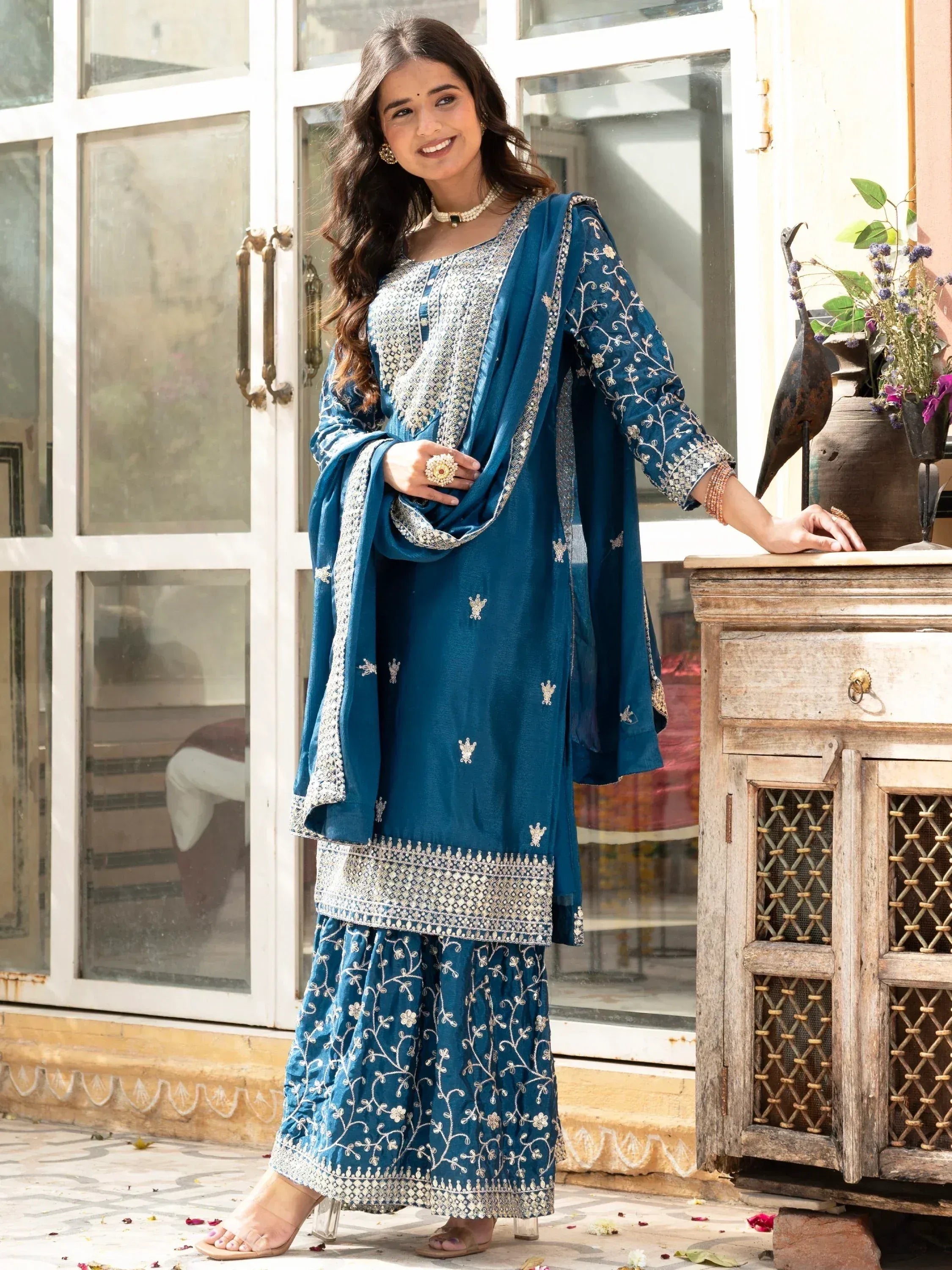 Teal embroidered salwar kameez with floral detailing, perfect for Indian ethnic wear occasions