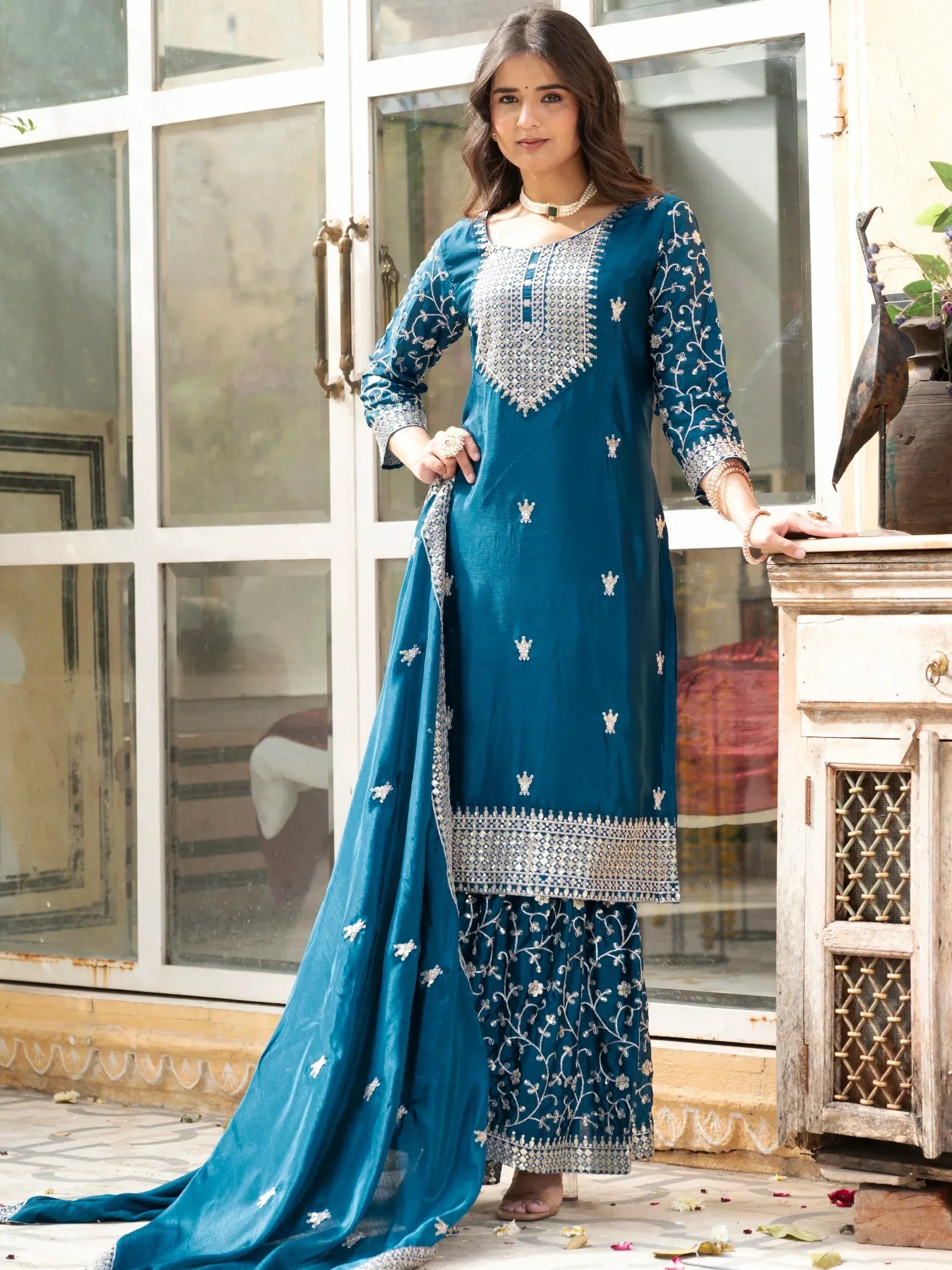 Teal embroidered salwar kameez with silver detailing, perfect for Indian ethnic wear occasions