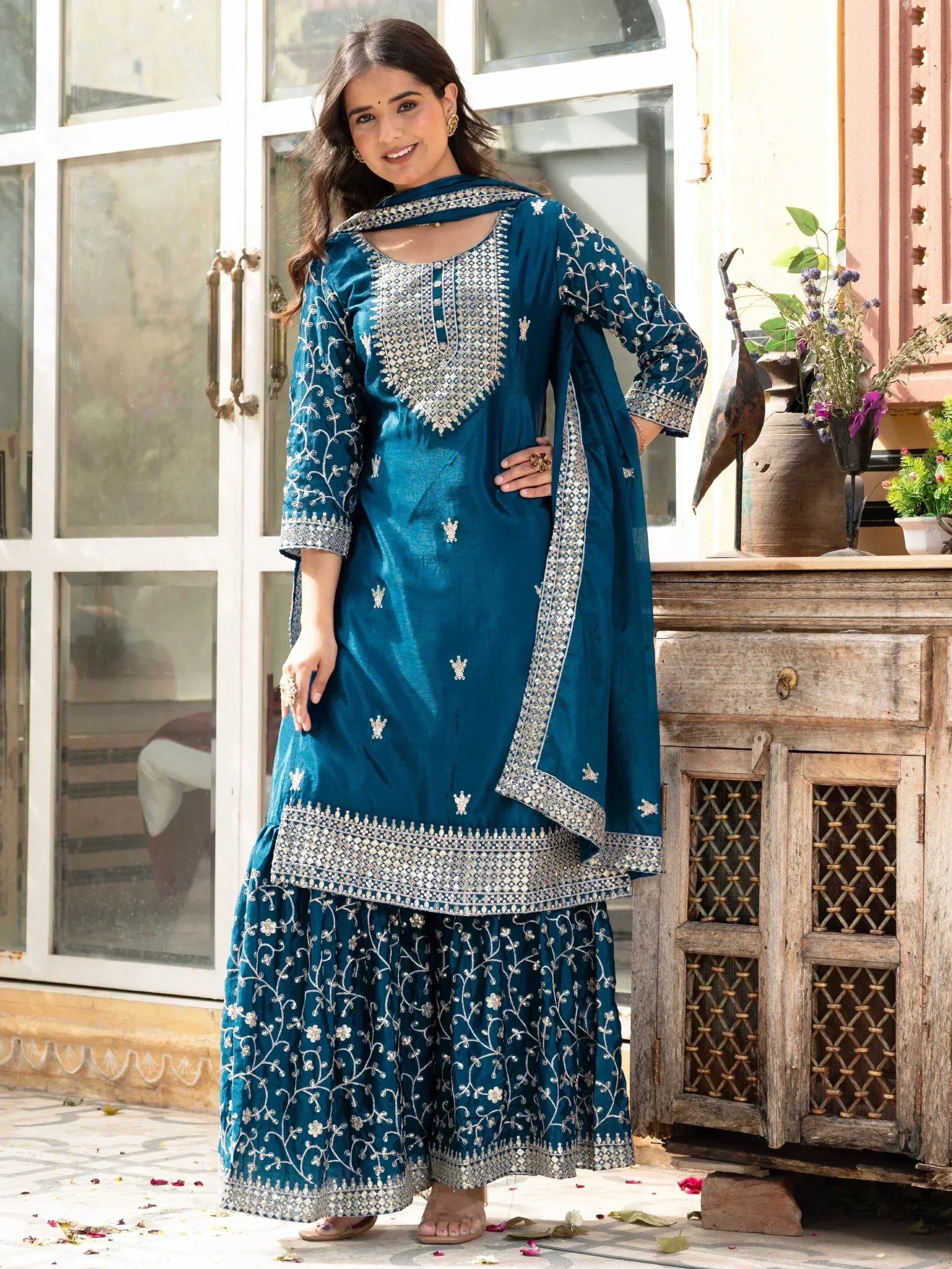 Teal embroidered salwar kameez with silver work, perfect for Indian ethnic wear occasions