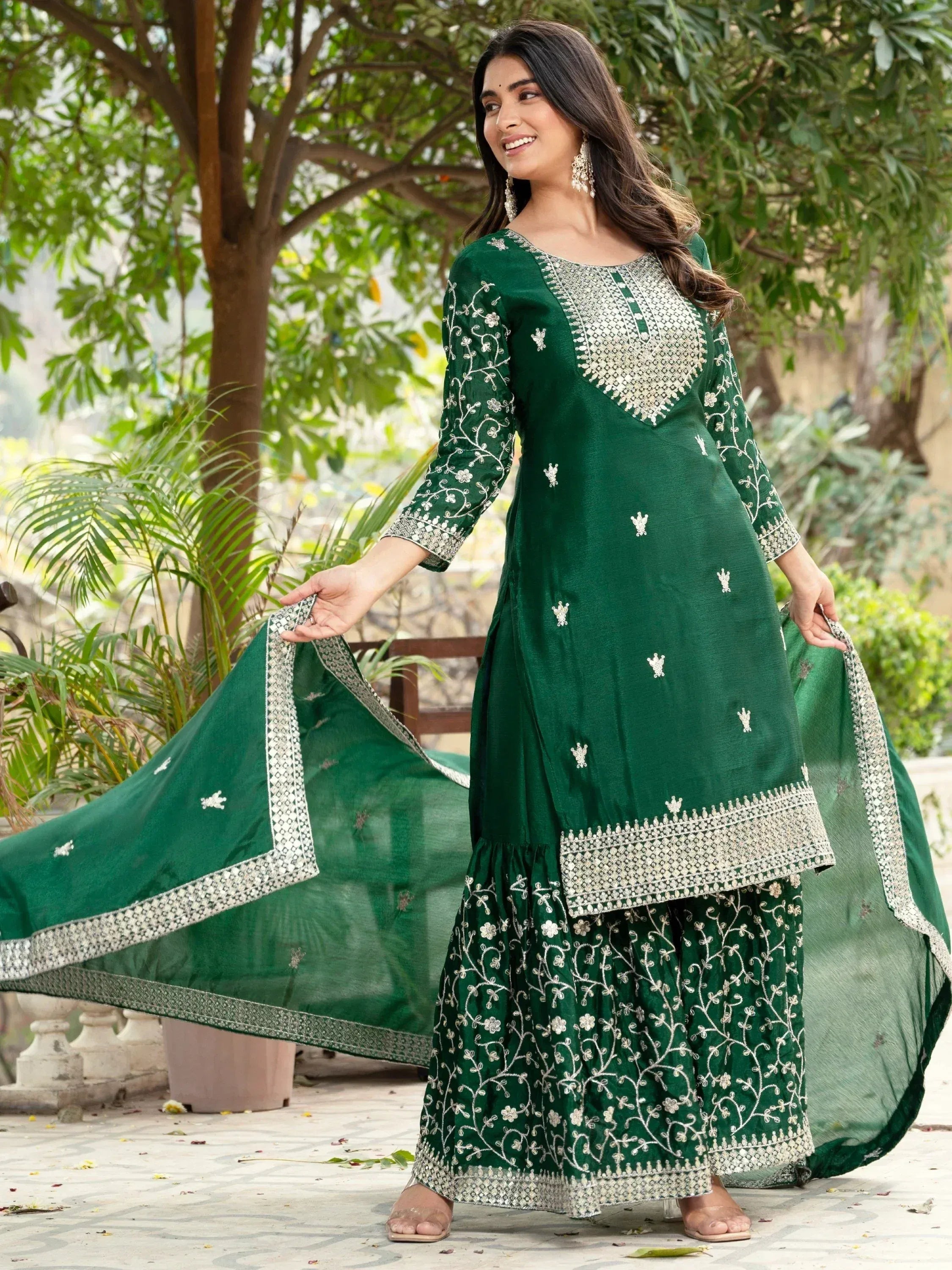 Emerald green embroidered salwar kameez with floral motifs and dupatta, perfect for Indian ethnic wear
