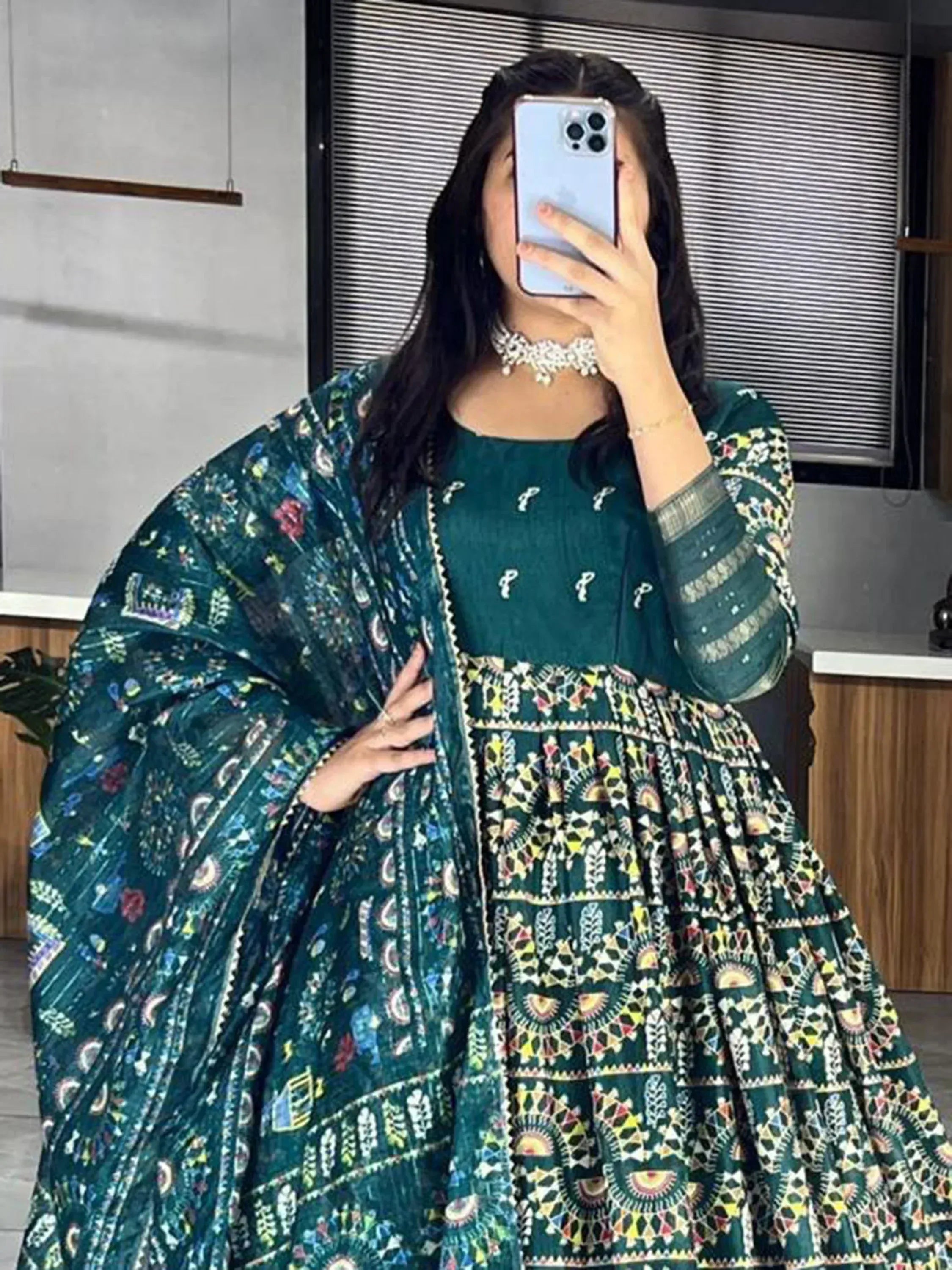 Emerald green printed ethnic gown with matching dupatta, perfect for festive occasions and Indian wear.