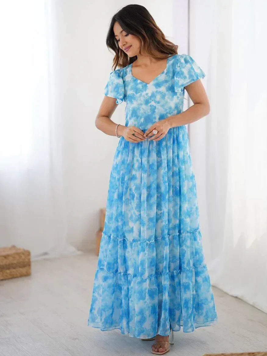 Blue tie-dye ethnic gown with ruffled sleeves and tiered skirt, perfect for Indian festive occasions