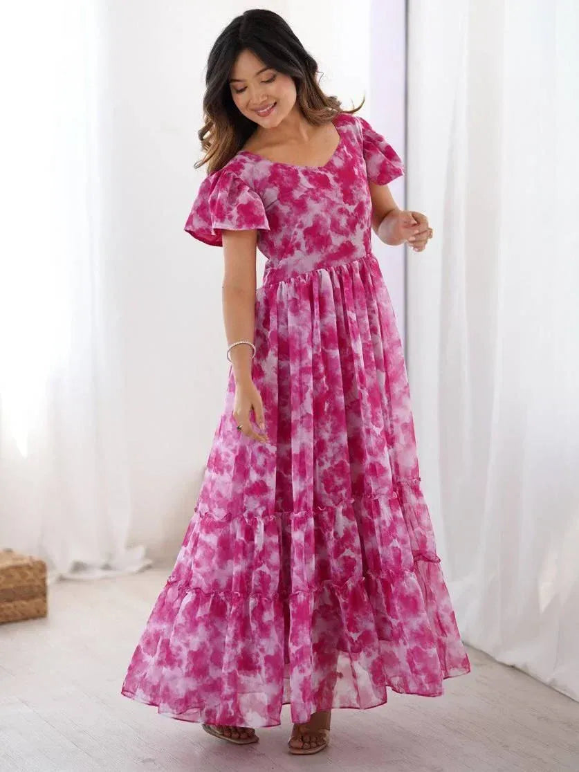 Pink tie-dye ethnic gown with ruffled sleeves and tiered skirt, perfect for festive occasions