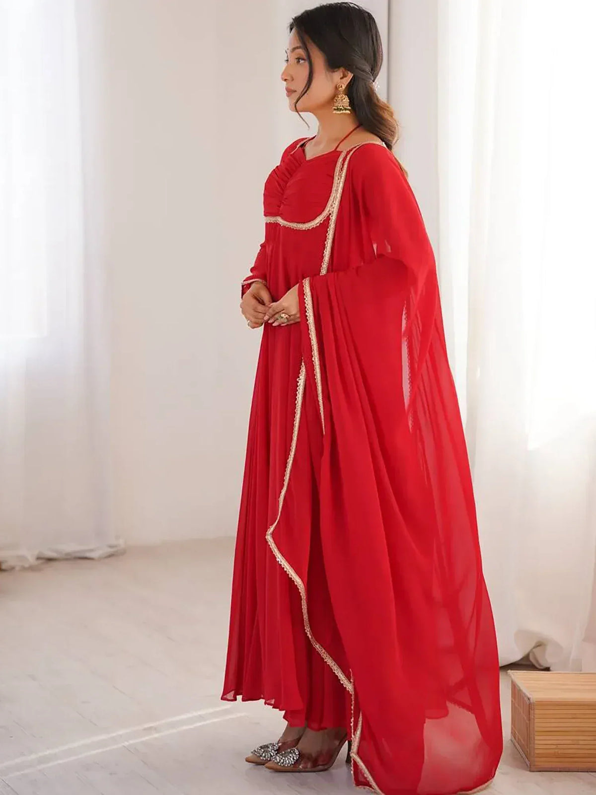 Red ethnic gown with gold trim, perfect for Indian occasions and festive wear